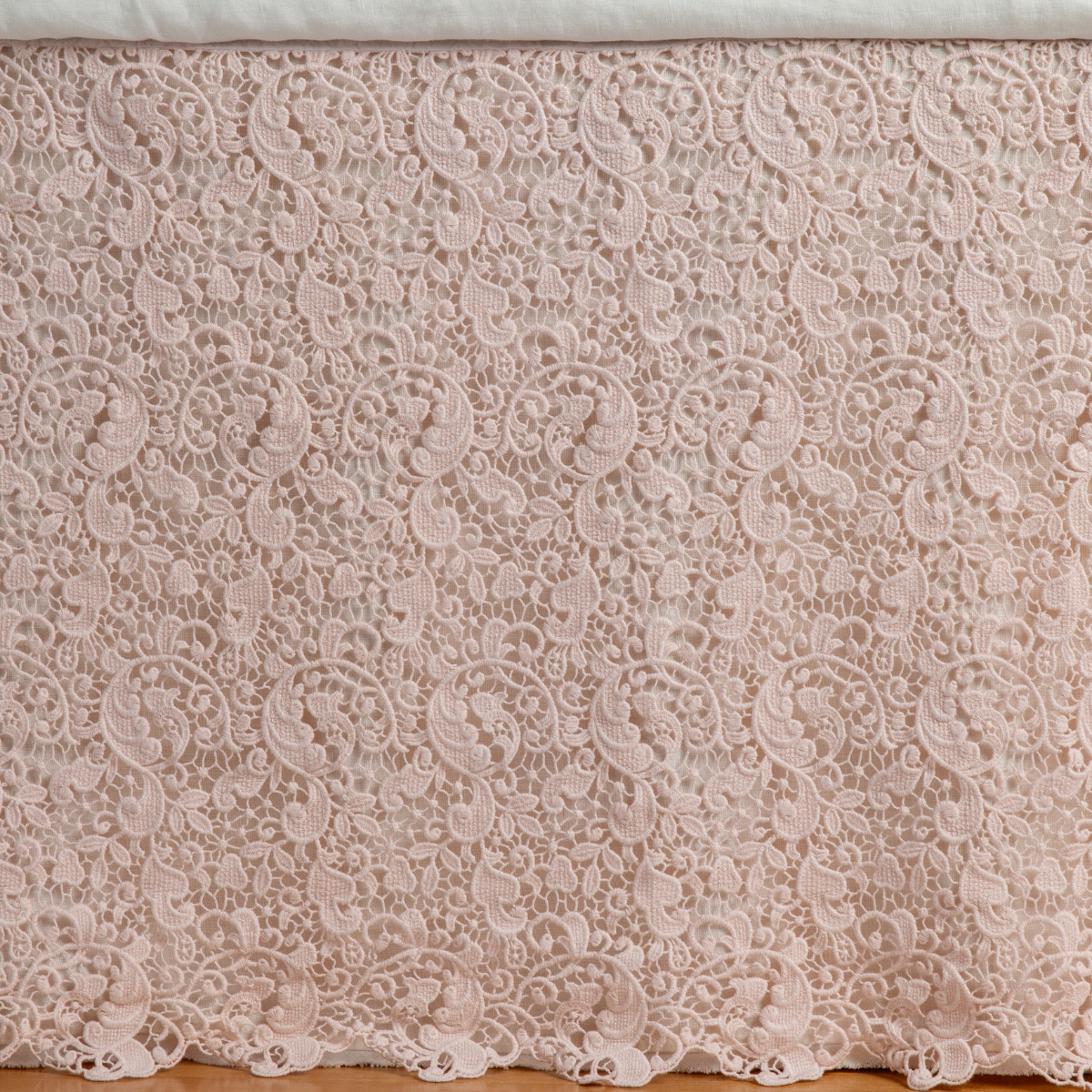 Pearl: a close up of a cotton lace bed skirt layered over a winter white bed skirt - shot straight at the bed skirt.