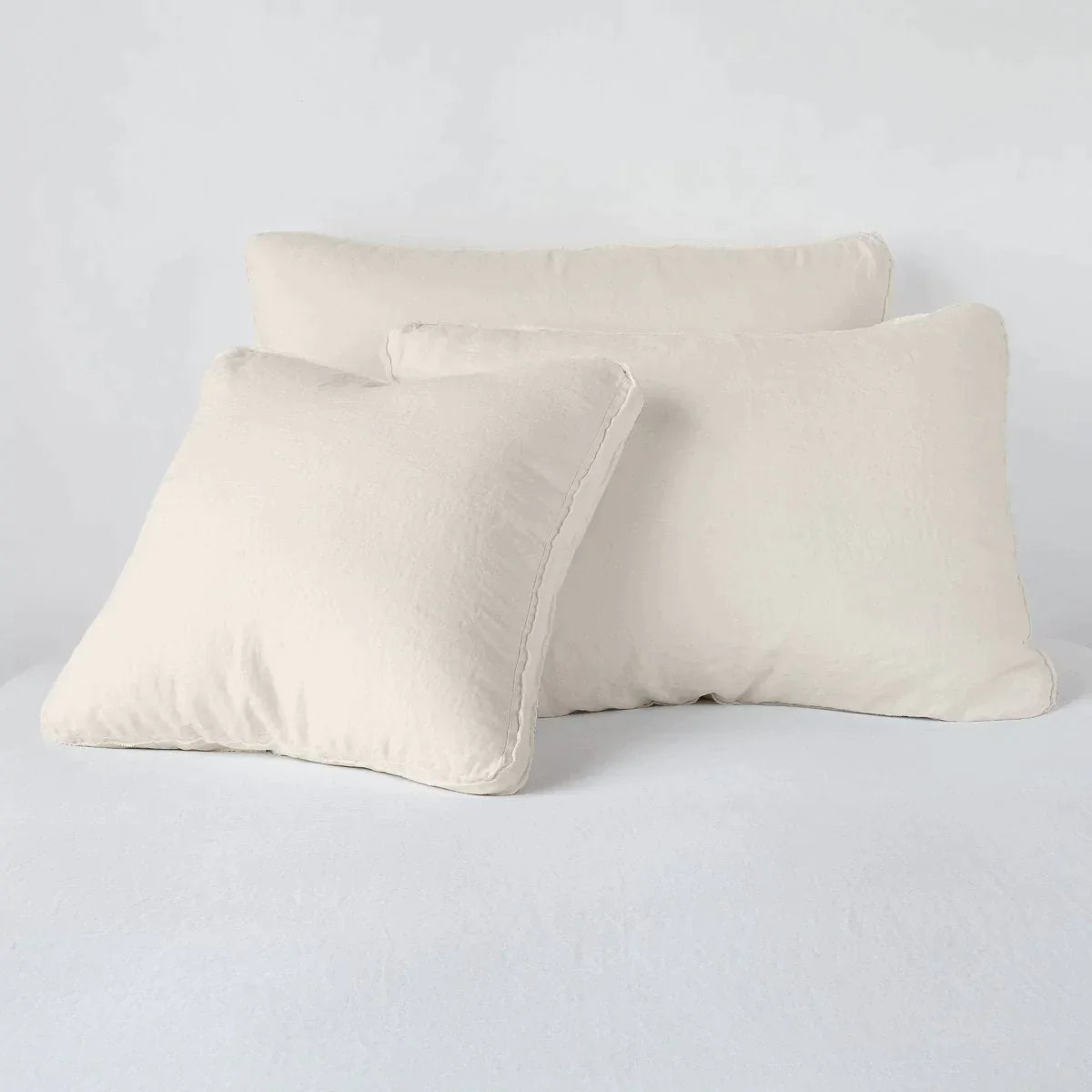 Parchment: Midweight linen shams in parchment colorway shown leaning upright on white background.
