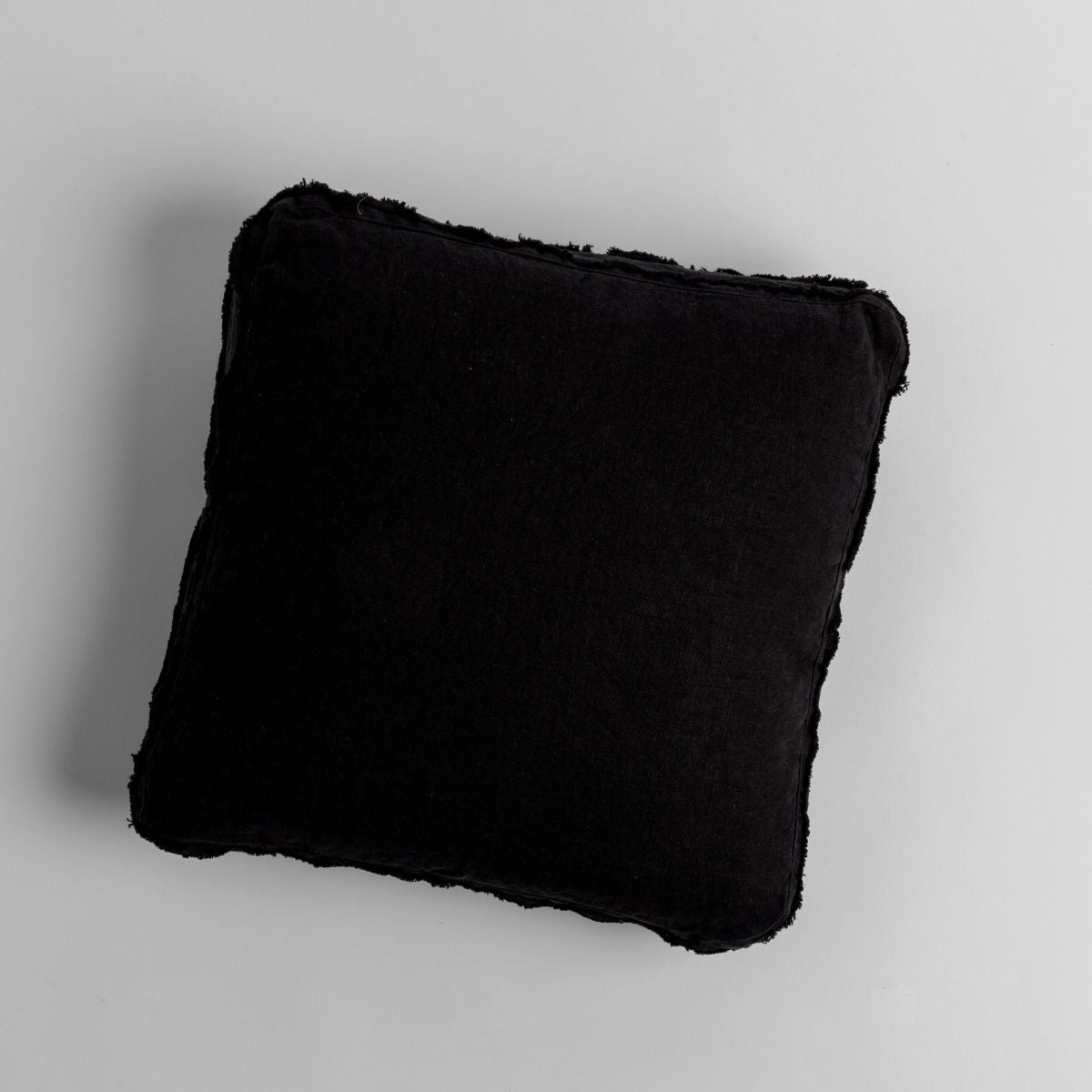 Corvino: midweight linen 18x18 inch throw pillow shot from overhead against a white background.