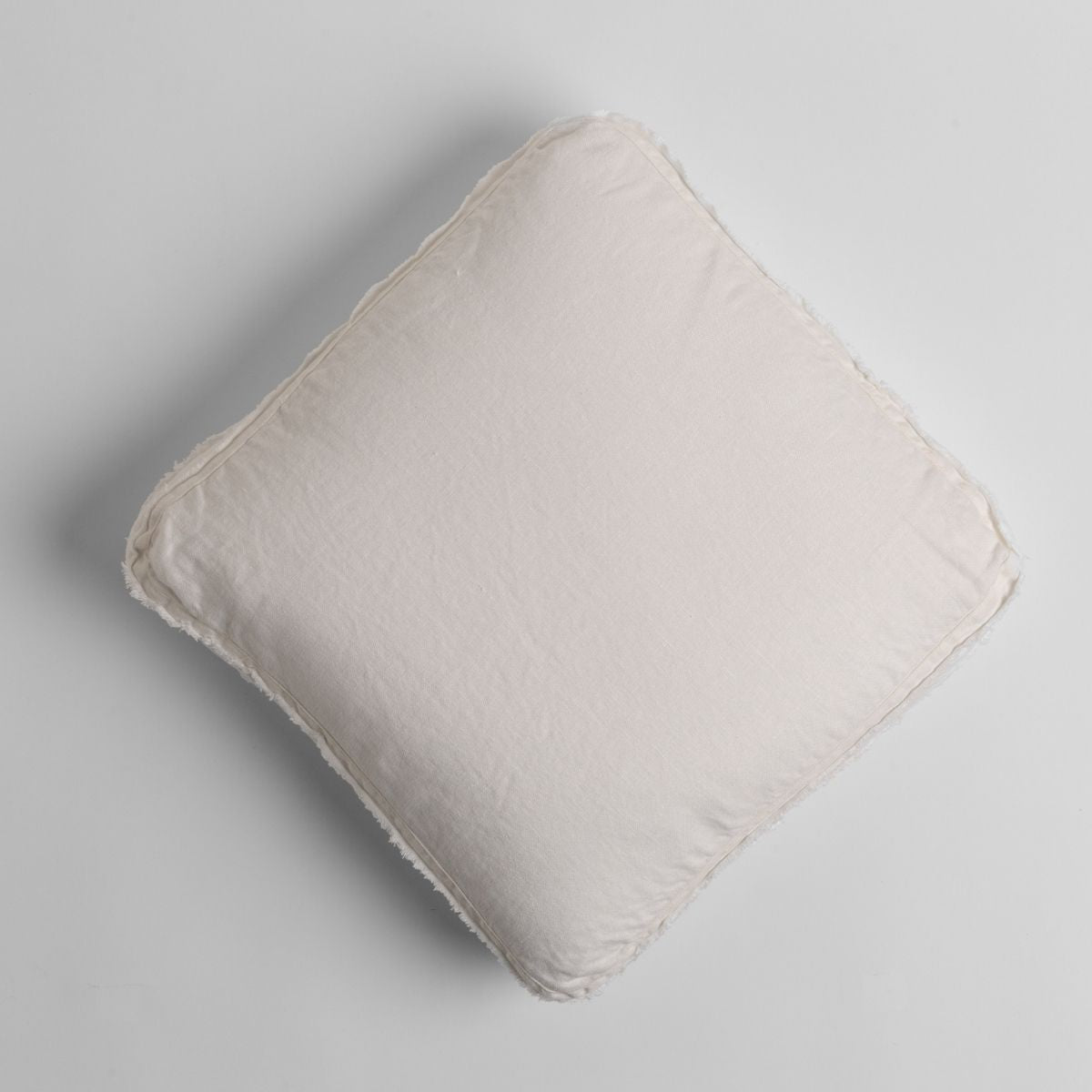 Winter White: midweight linen 18x18 inch throw pillow shot from overhead against a white background.