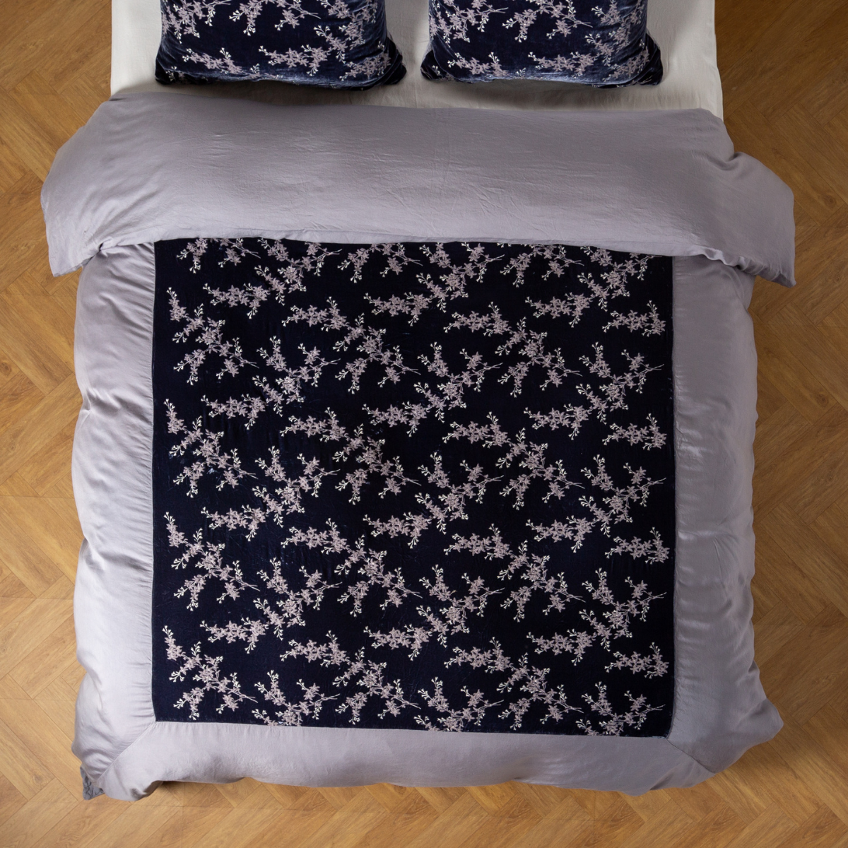 French Lavender: An overhead shot of an embroidered silk velvet and tencel duvet cover and matching shams.