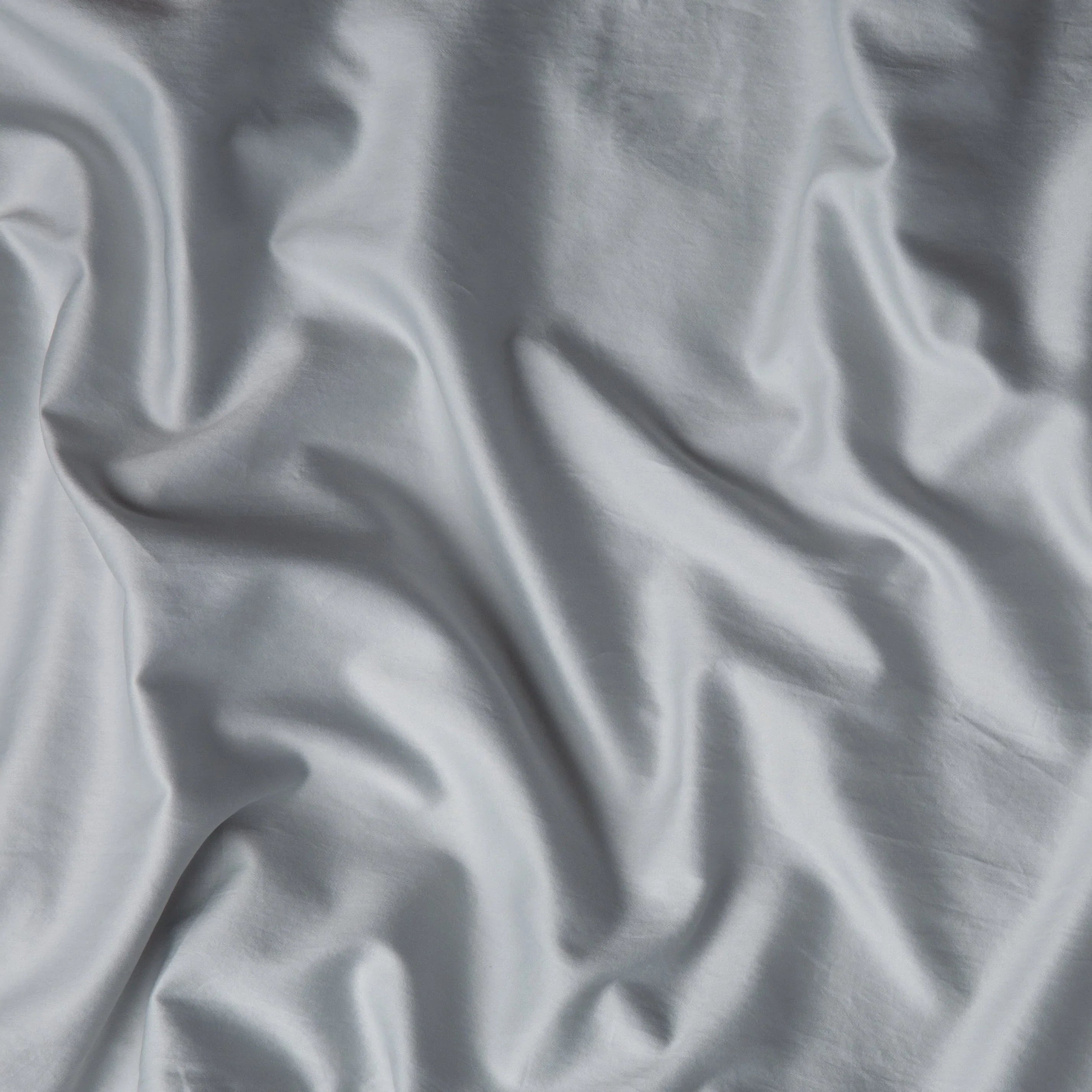 Cloud: A close up of cotton sateen fabric in cloud, a soft, subtle sky blue-grey.