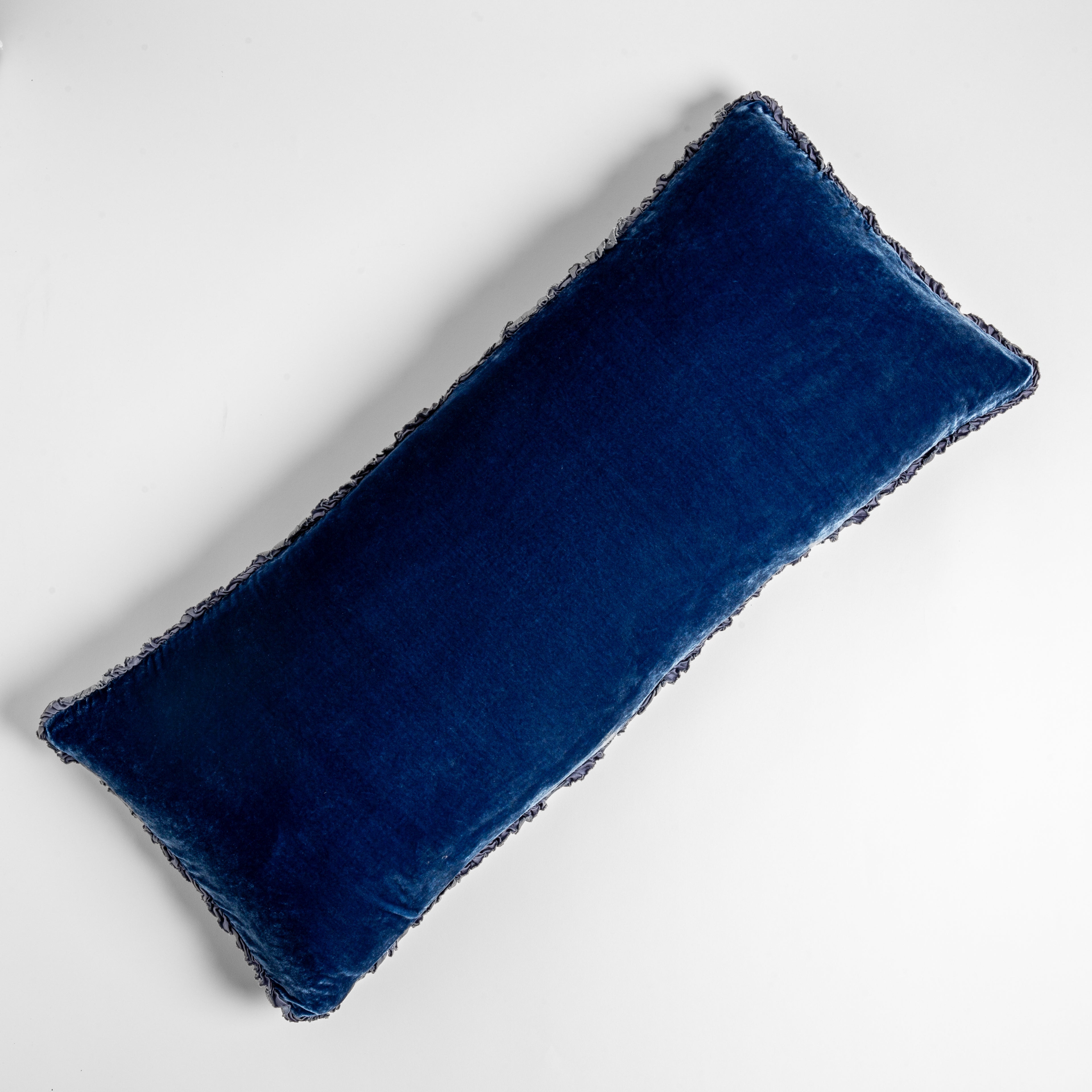 Tahoe Blue: pillow laid on a plain white background, petite ruffle detail on all four sides.