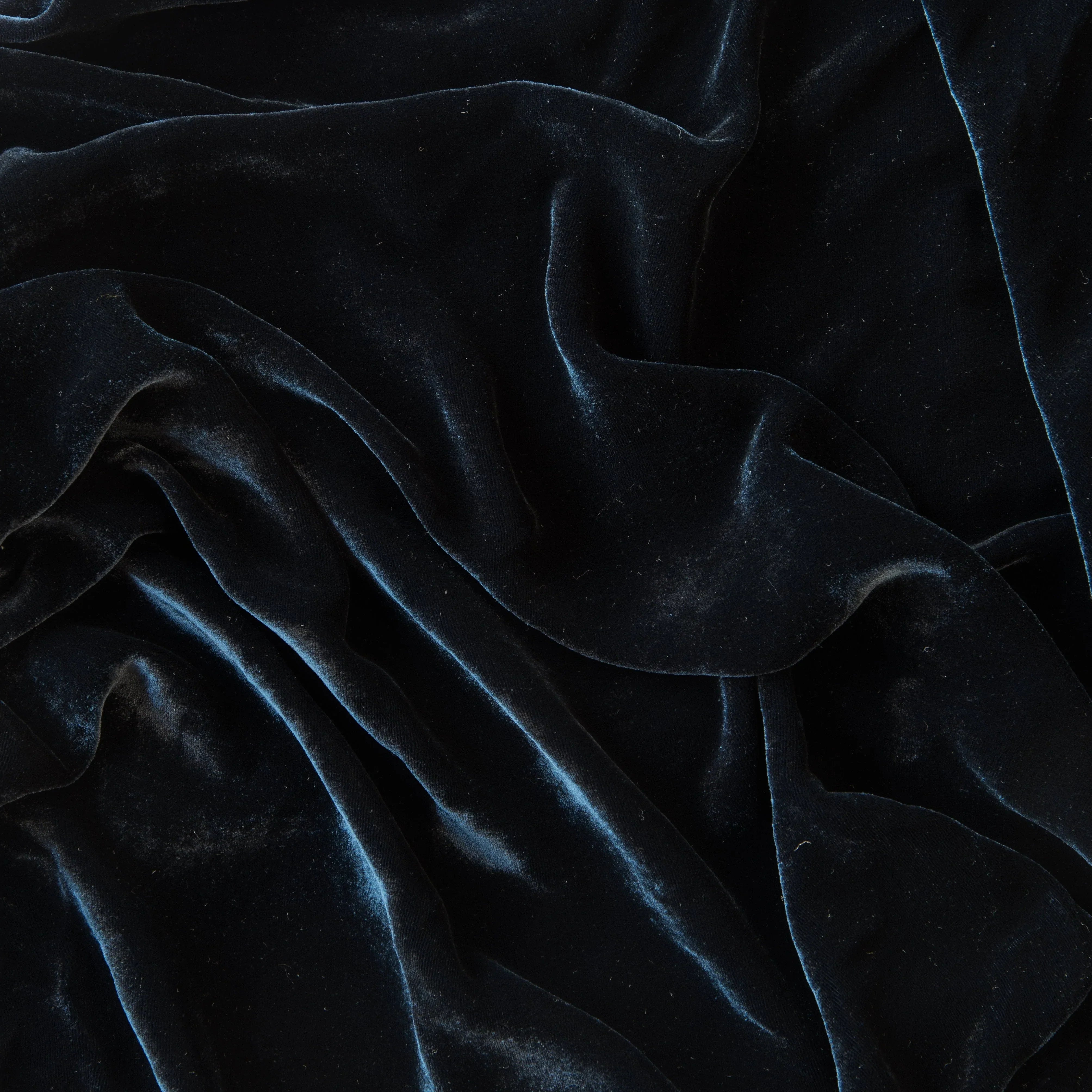 Midnight: A close up of silk velvet in midnight, a rich indigo tone.