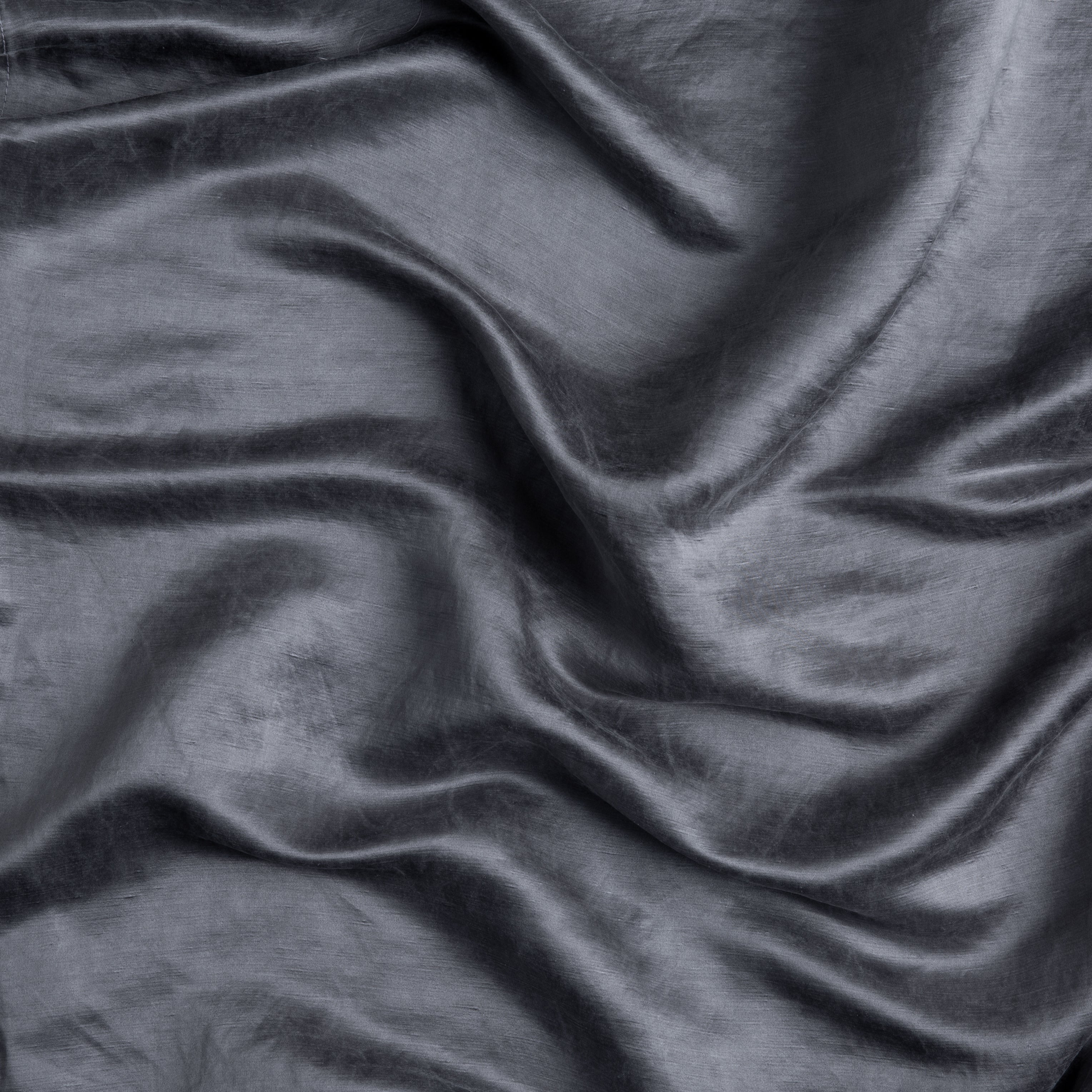 A close up of charmeuse gently rumpled in french lavender, a neutral lavender tone.