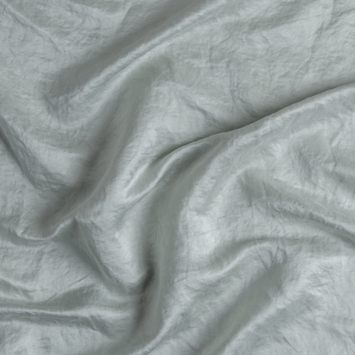 Cloud: A close up of charmeuse fabric in cloud, a soft, subtle sky blue-grey.