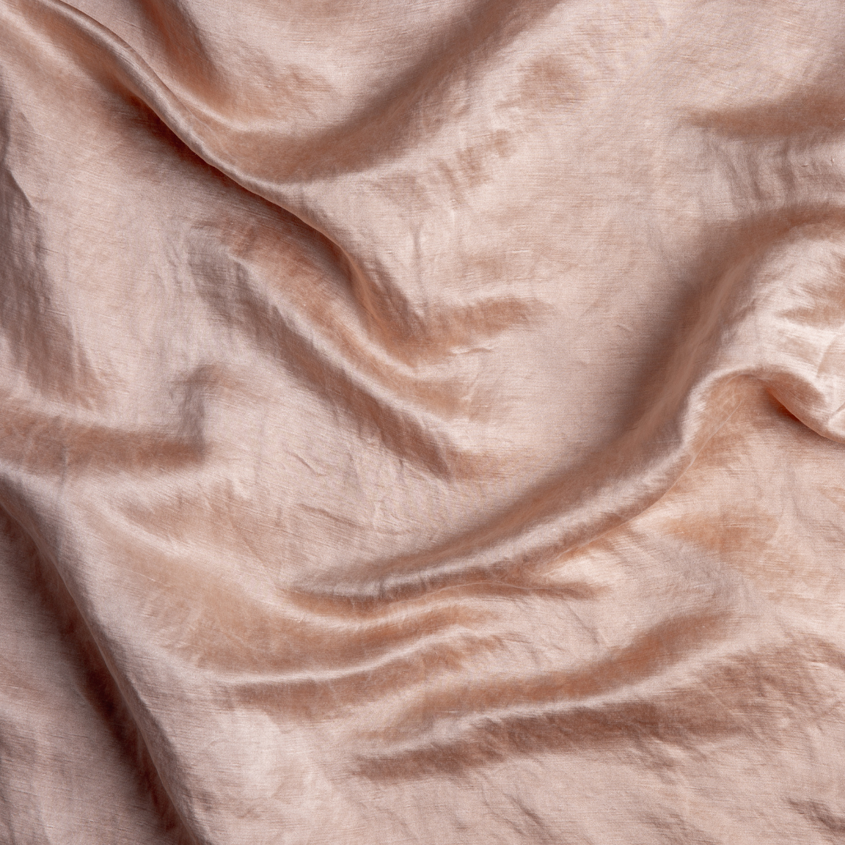 Rouge: A close up of charmeuse fabric in rouge, a mid-tone blush pink.
