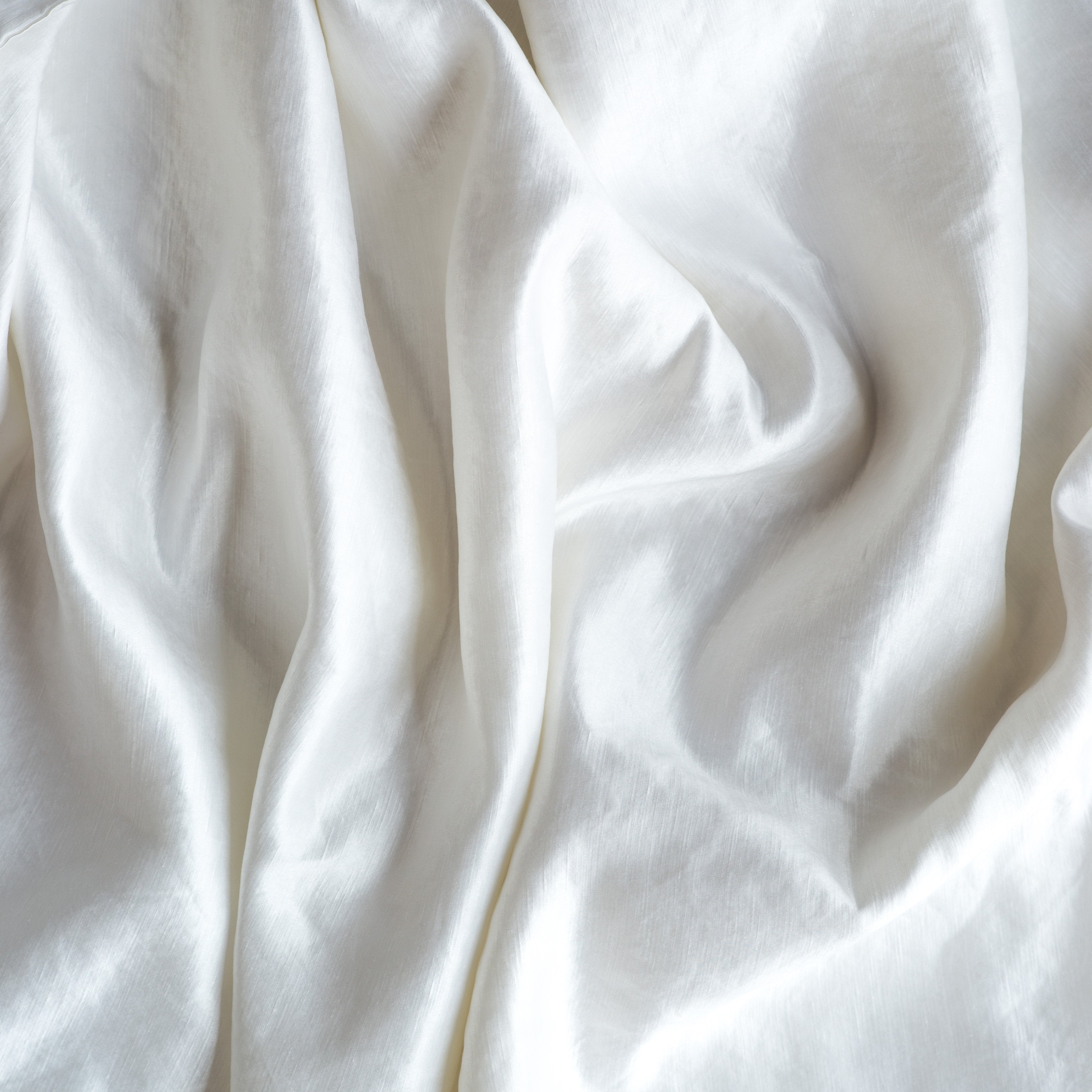 White: Close-up of silk charmeuse in white.