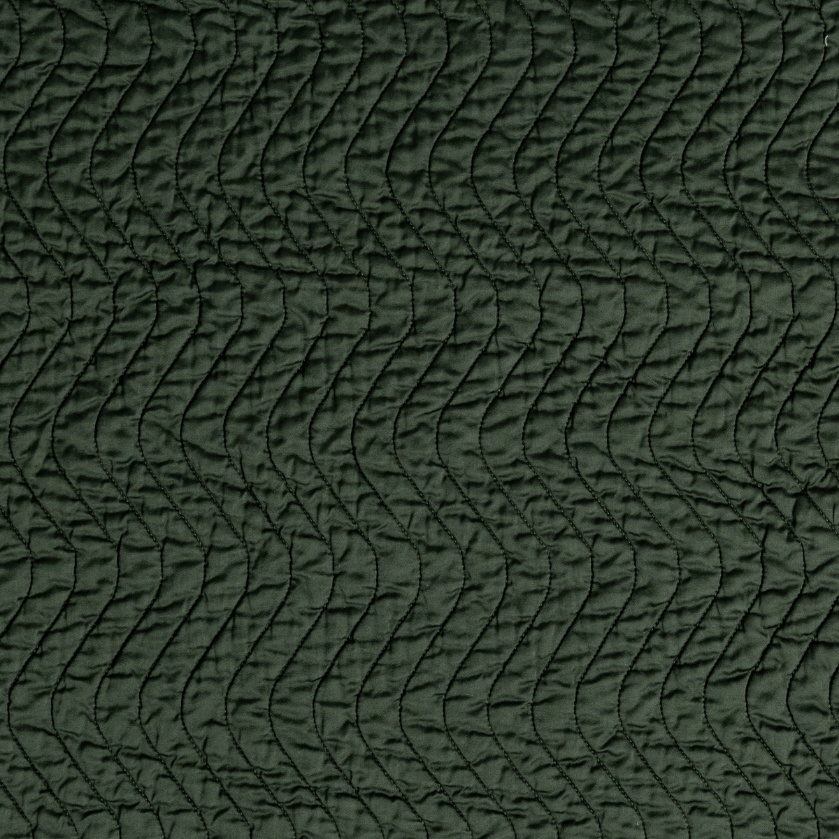 Juniper: A close up of quilted cotton sateen fabric in Juniper, a deep green tone.