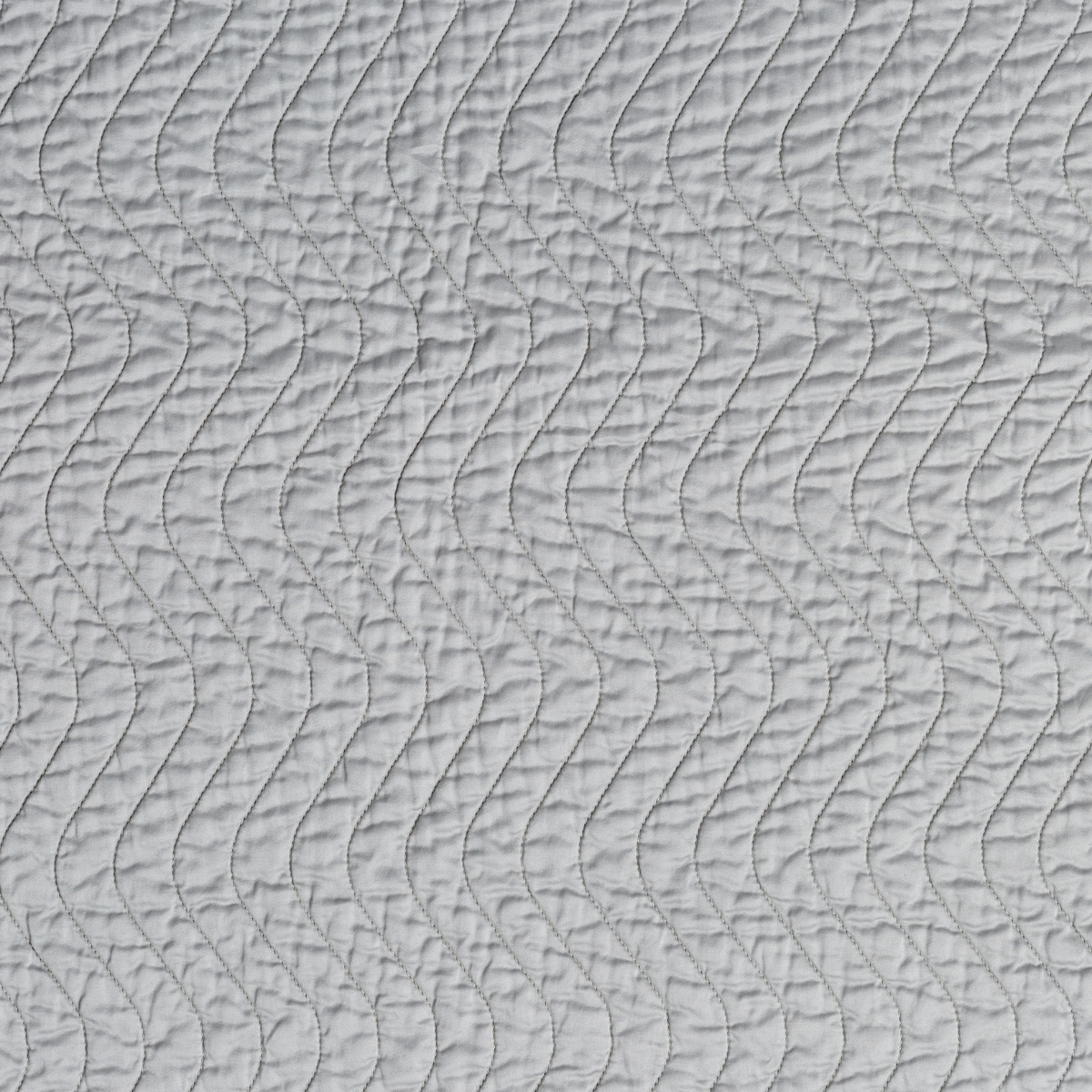 Mineral: A close up of quilted cotton sateen fabric in mineral, a soothing seafoam blue with subtle grey-green undertones.