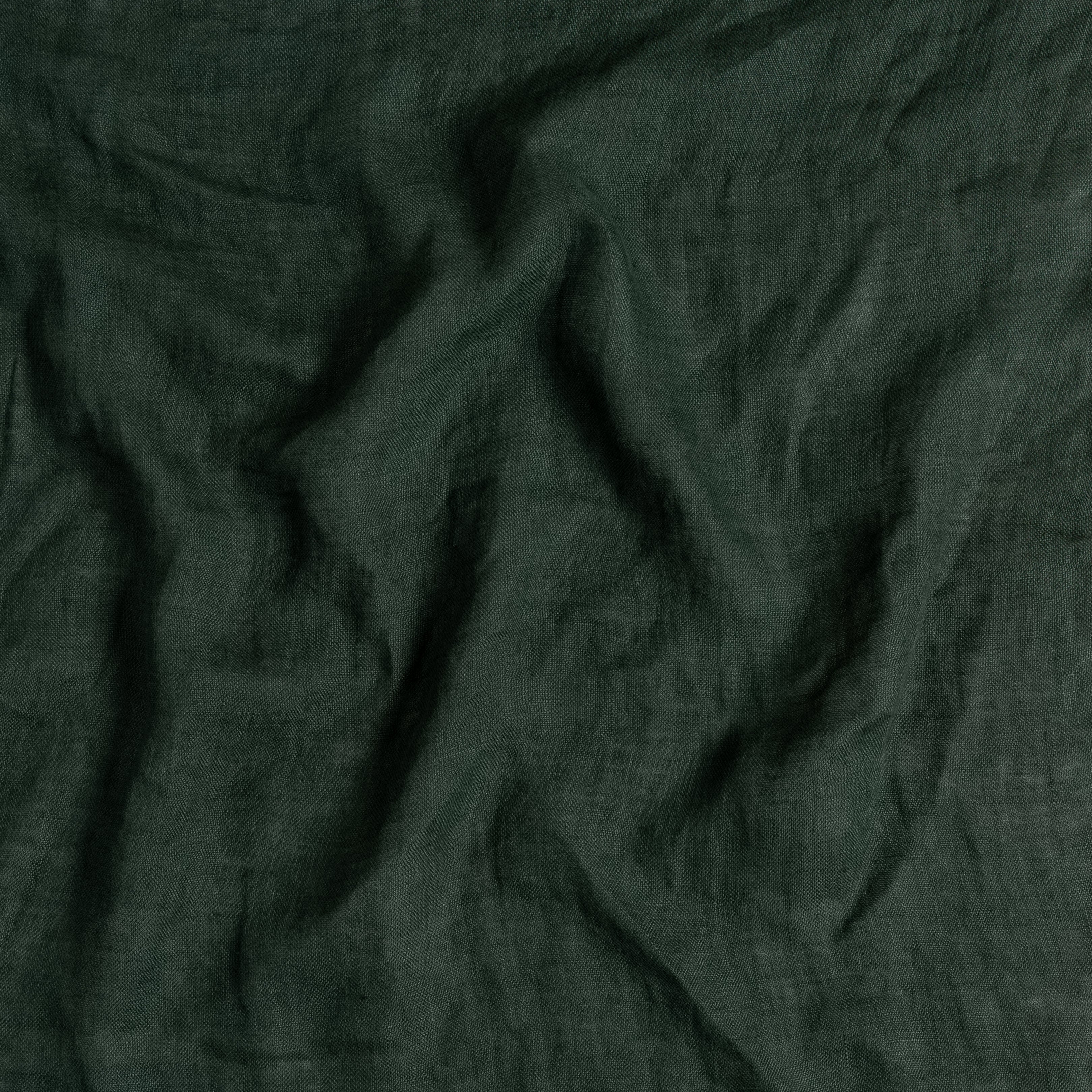 Close up of linen whisper fabric in juniper, a dark green tone.