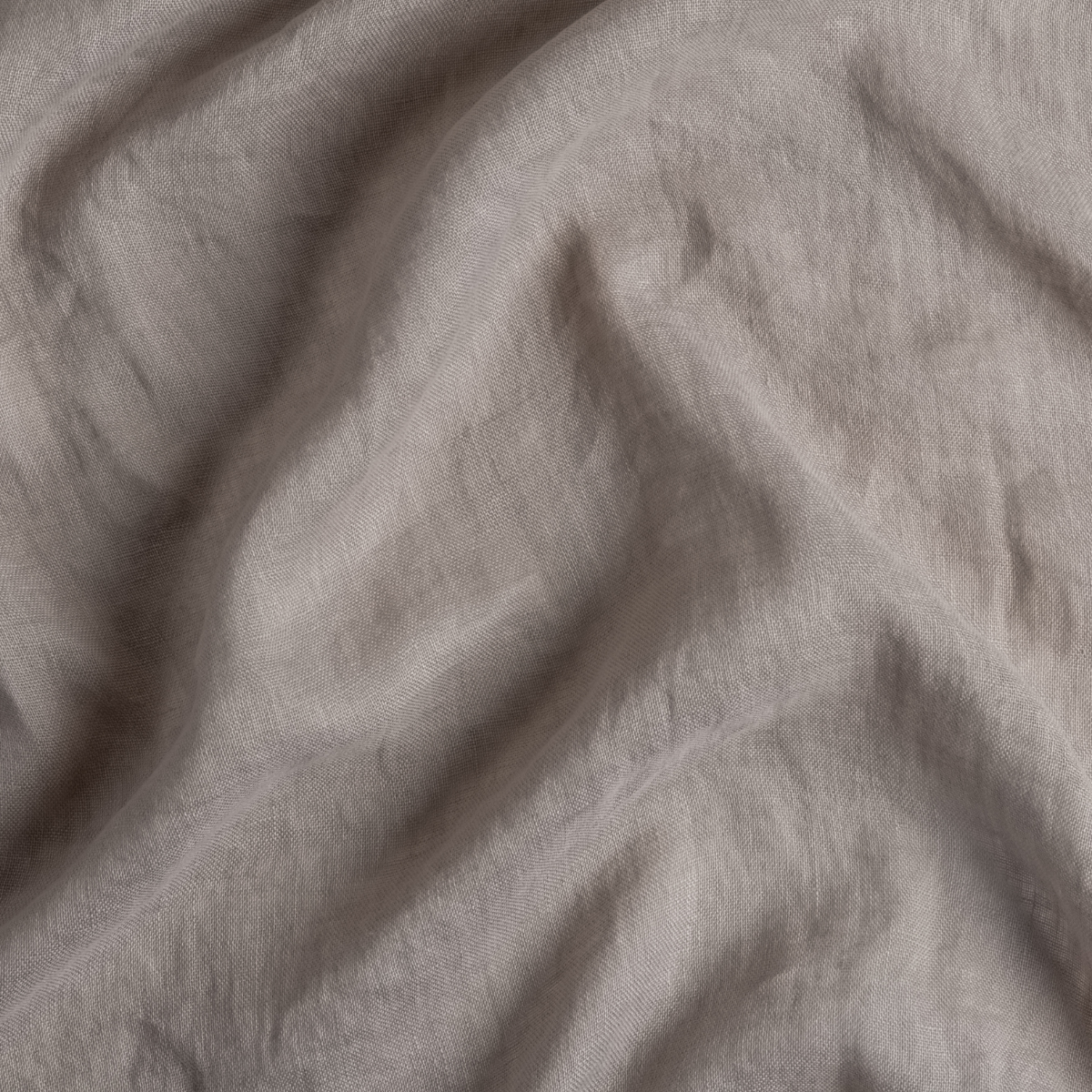 Fog: A close up of linen whisper fabric in fog, a neutral-warm, soft mid-tone grey.