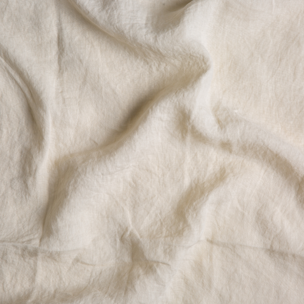 Parchment: A close up of linen fabric in parchment, a warm, antiqued cream.