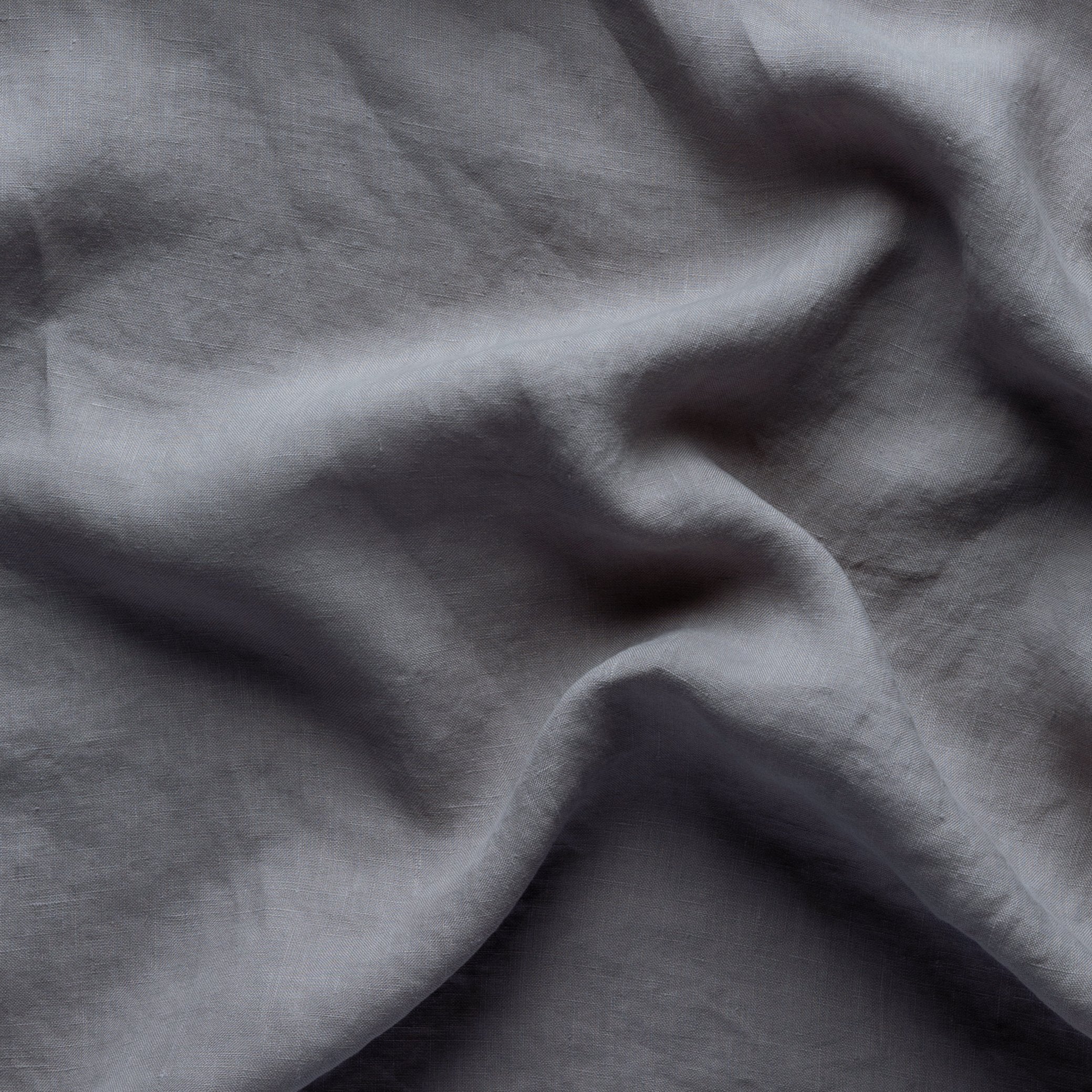 Moonlight: A close up of linen in moonlight, a saturated, cool, mid-dark grey tone.