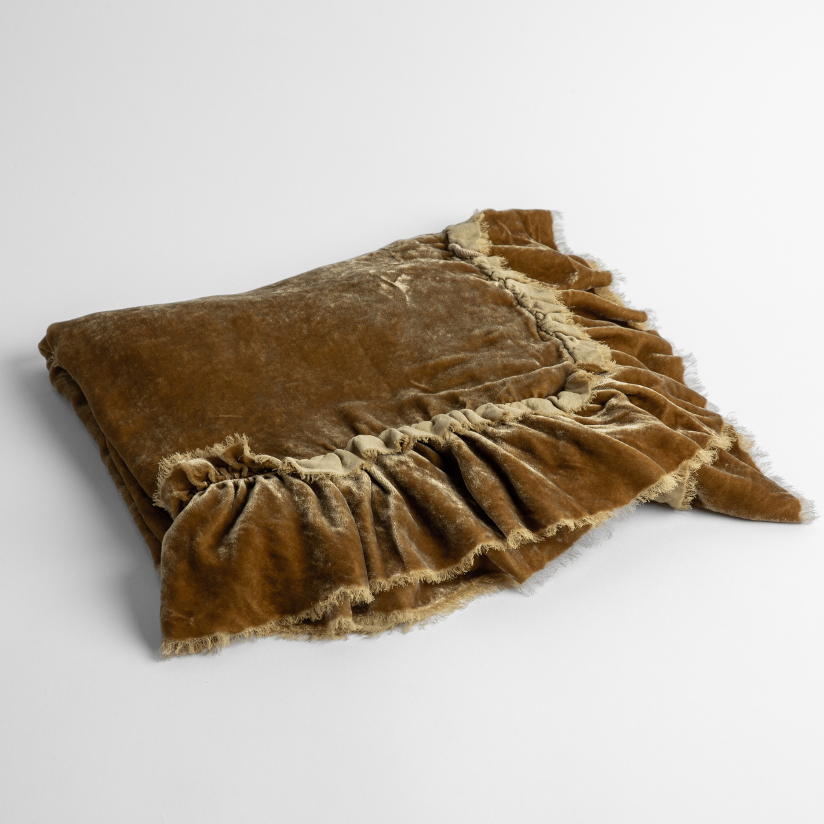 Honeycomb: an overhead shot of a folded silk velvet baby blanket with a raw-edged eyelash ruffle detail.