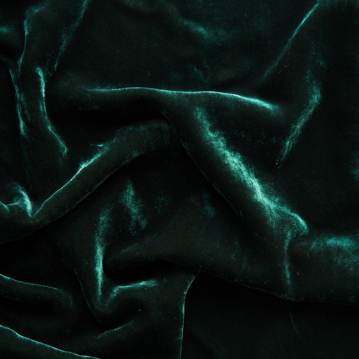 Jade: A close up of silk velvet in jade, a rich, verdant green with subtle blue undertones.