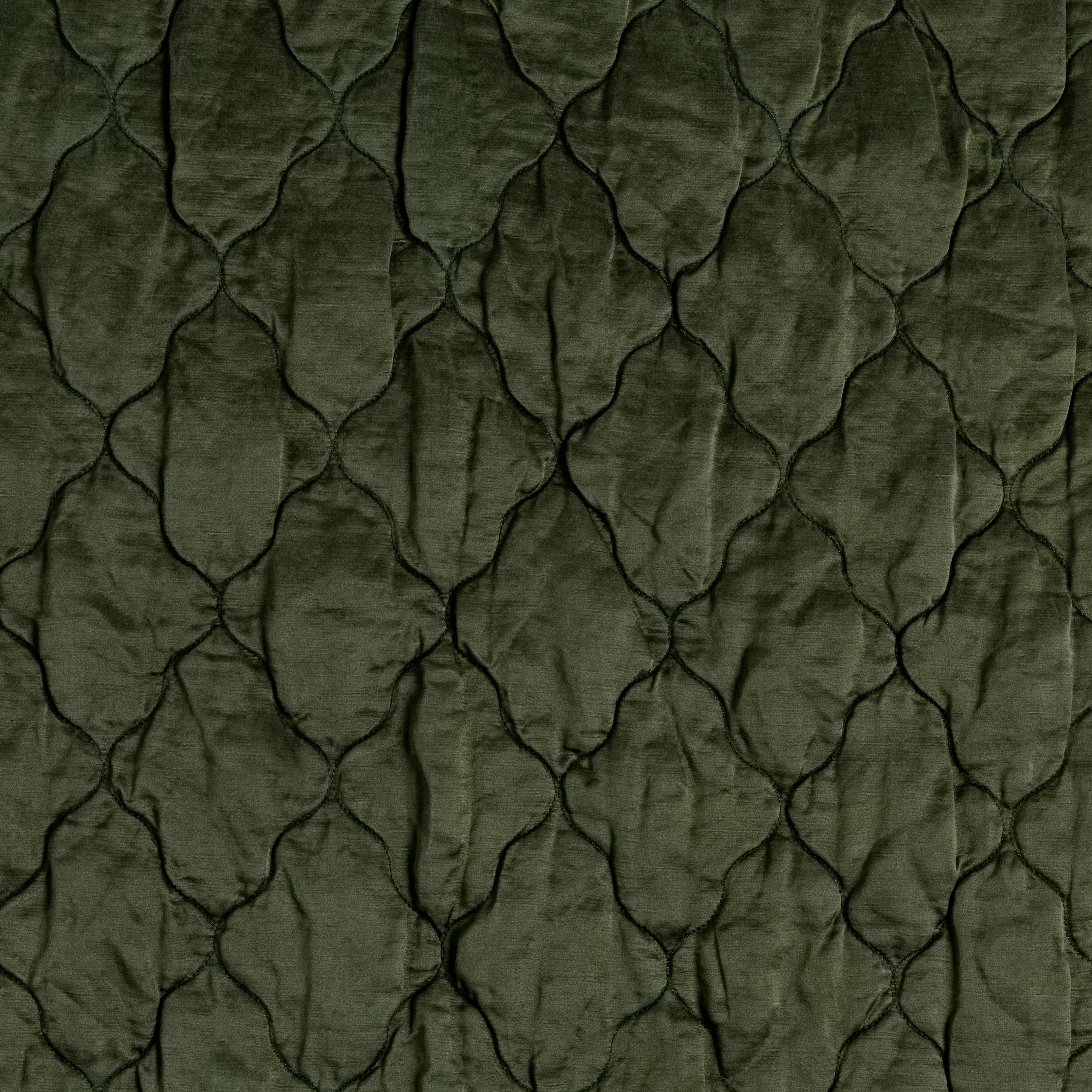 A close up of quilted charmeuse in juniper, a dark green tone.