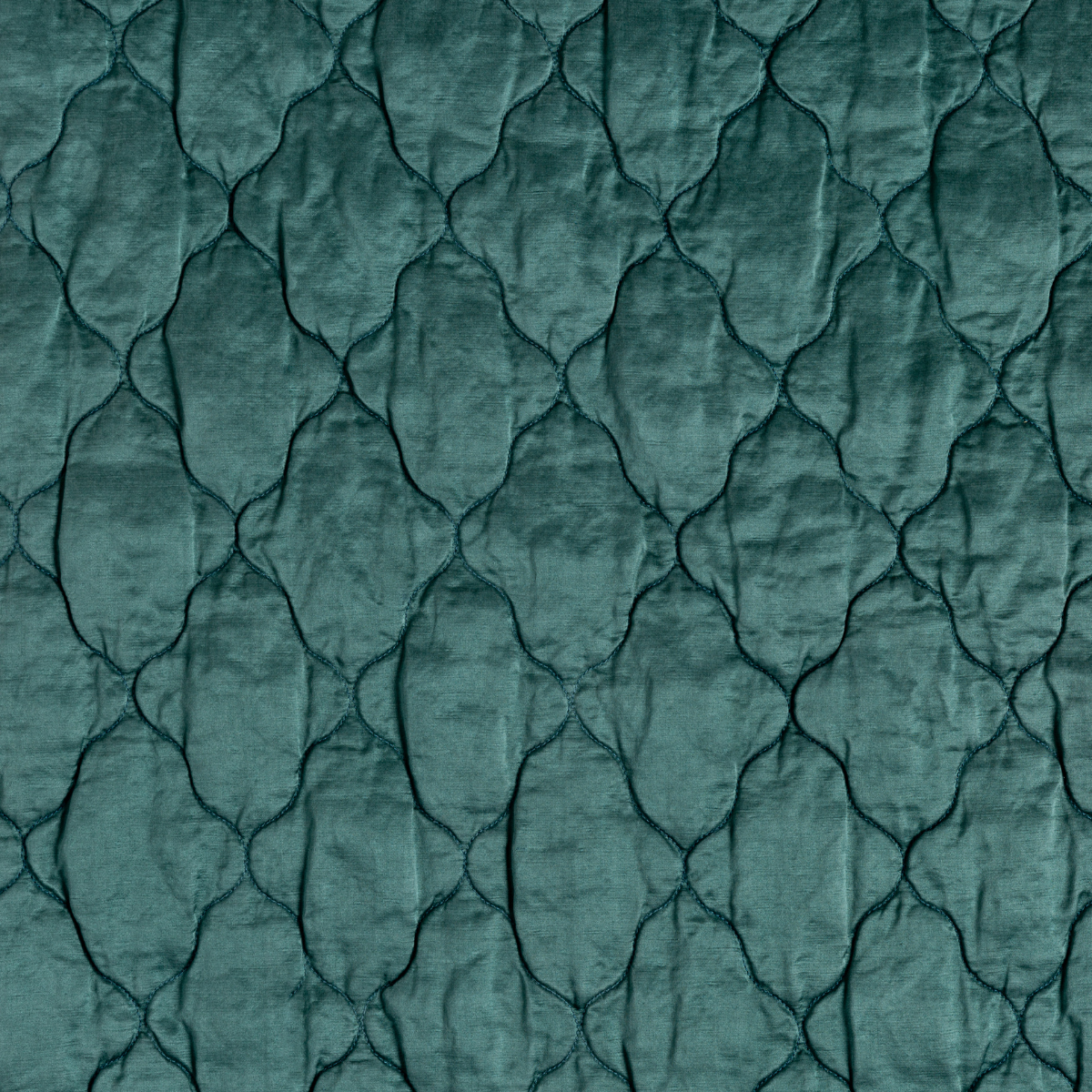 Cenote: A close up of quilted charmeuse fabric in cenote, a vibrant, ocean-inspired blue-green.