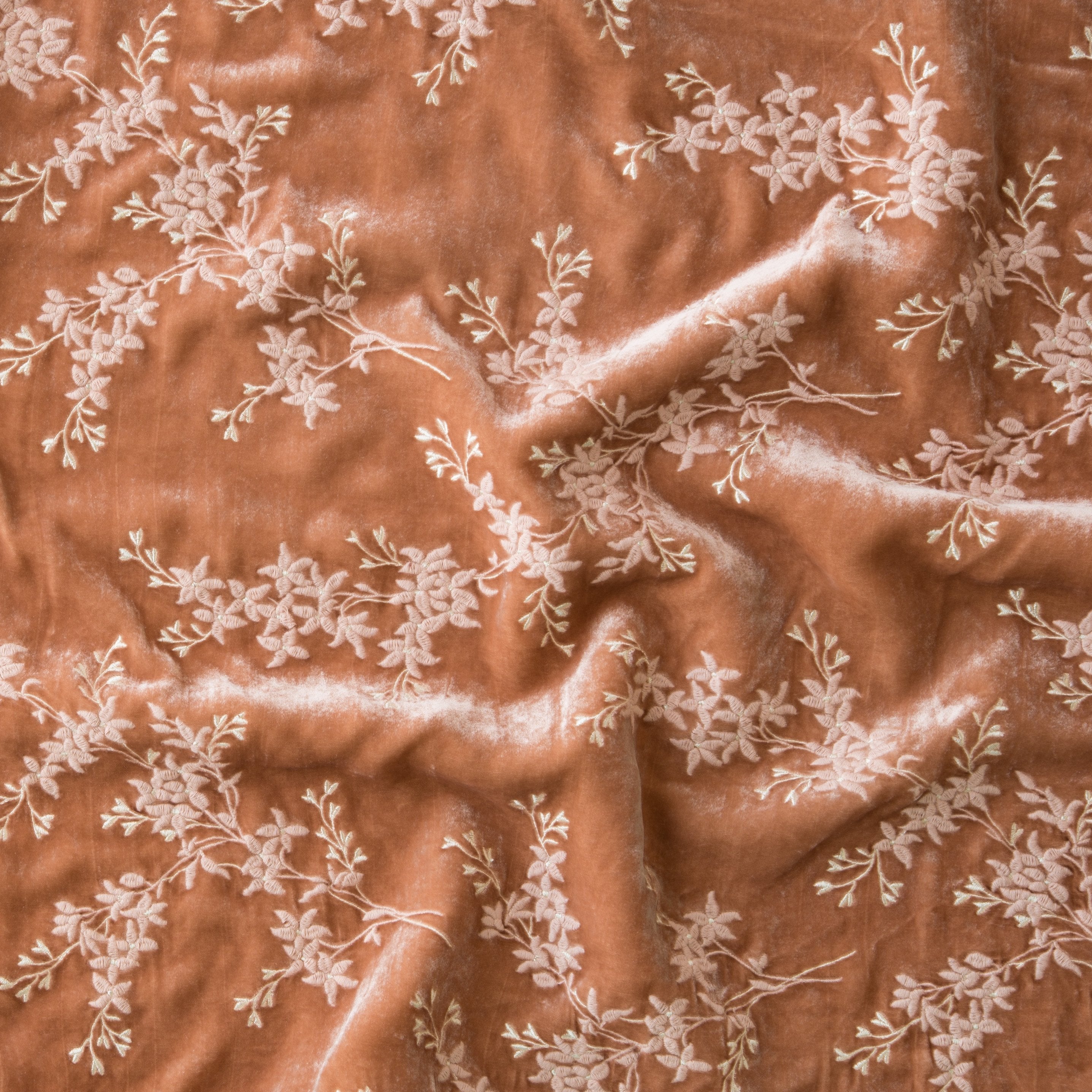 Rouge: A close up of Lynette embroidered silk velvet, in rouge, a mid-tone blush pink.