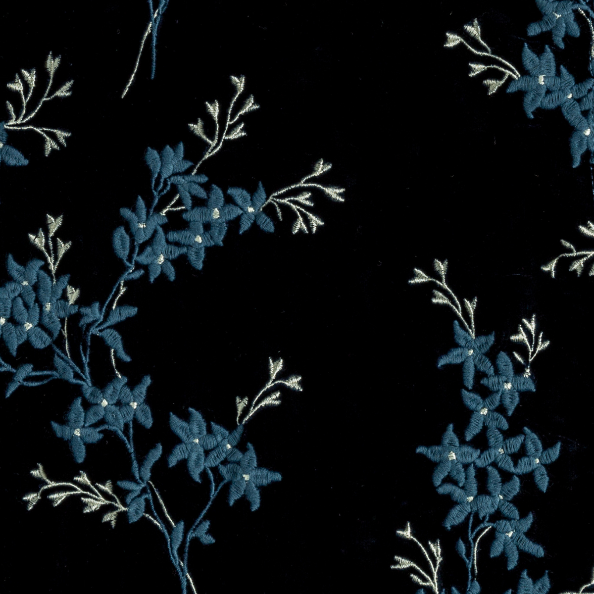 Midnight: A close up of embroidered silk velvet fabric in midnight, a rich indigo tone.