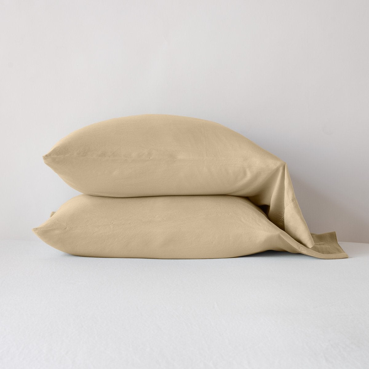 Honeycomb: sleeping pillows stacked neatly against a white backdrop - side view.