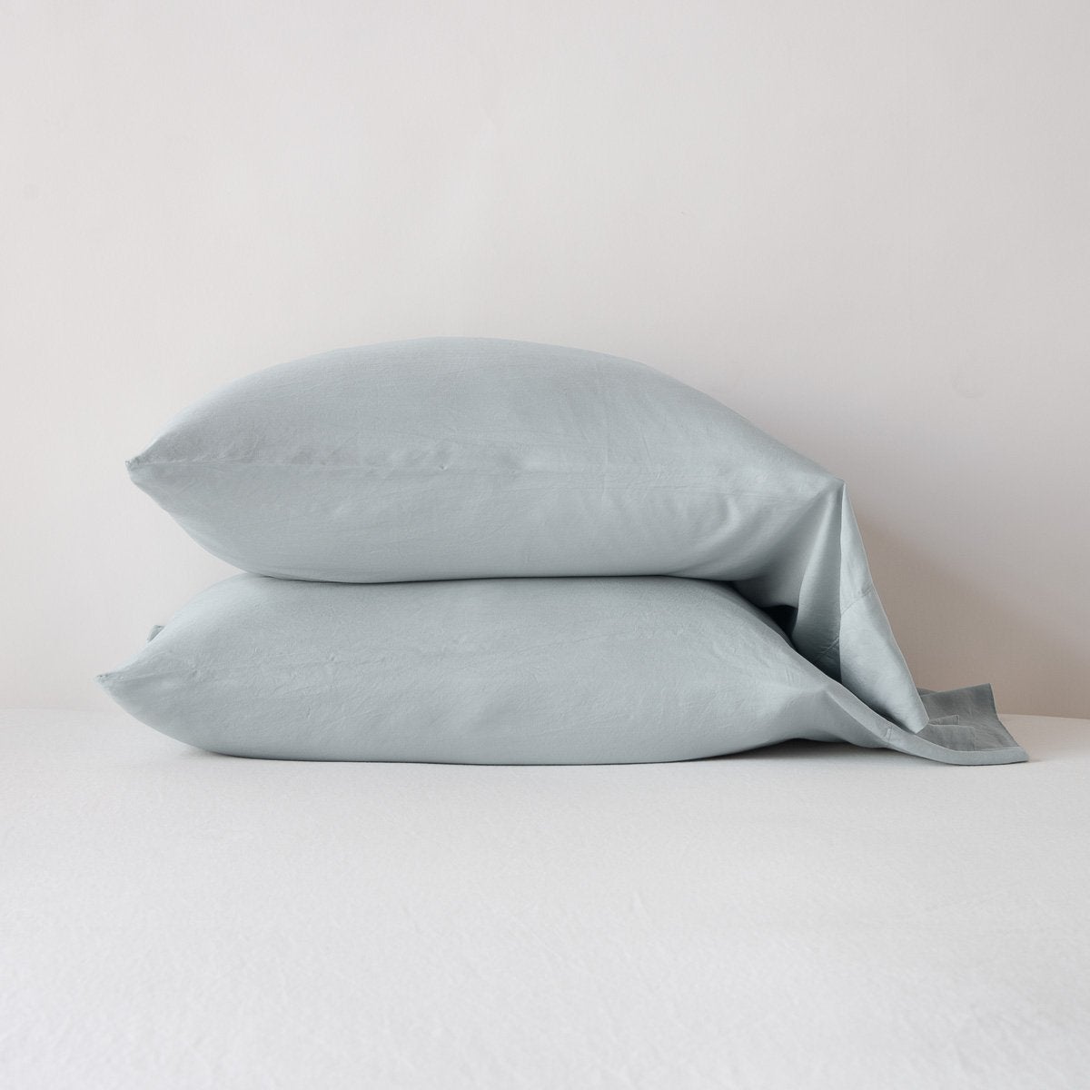 Mineral: sleeping pillows stacked neatly against a white backdrop - side view.