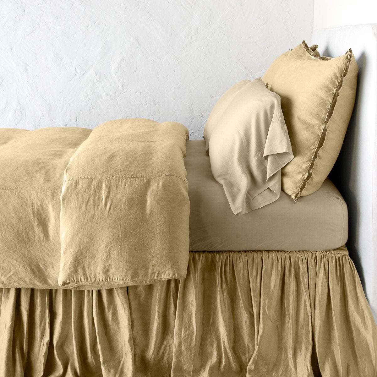 Honeycomb: duvet cover with matching pillows and bed skirt - side view.