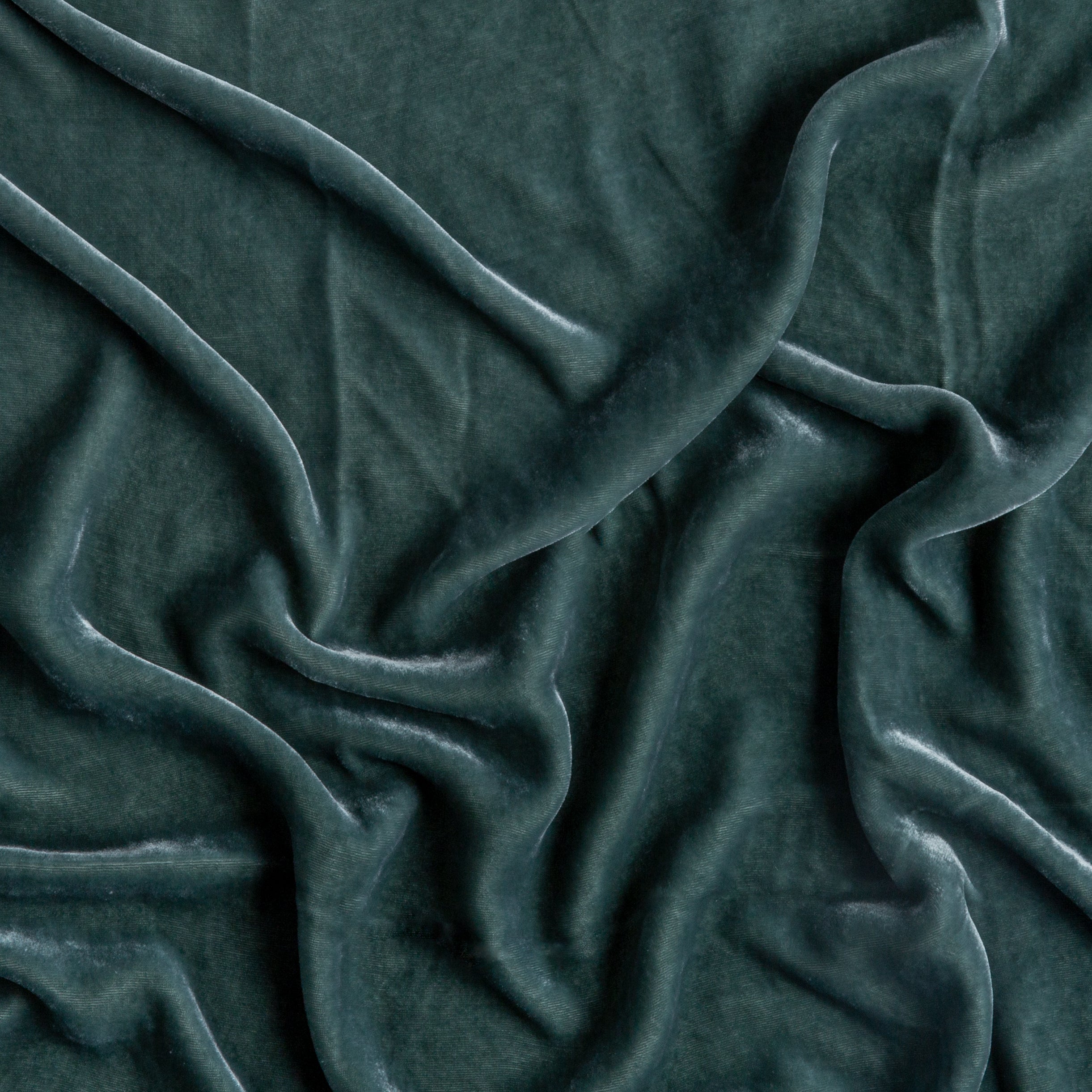 Eucalyptus: A close up of silk velvet fabric in eucalyptus, a soft light green.