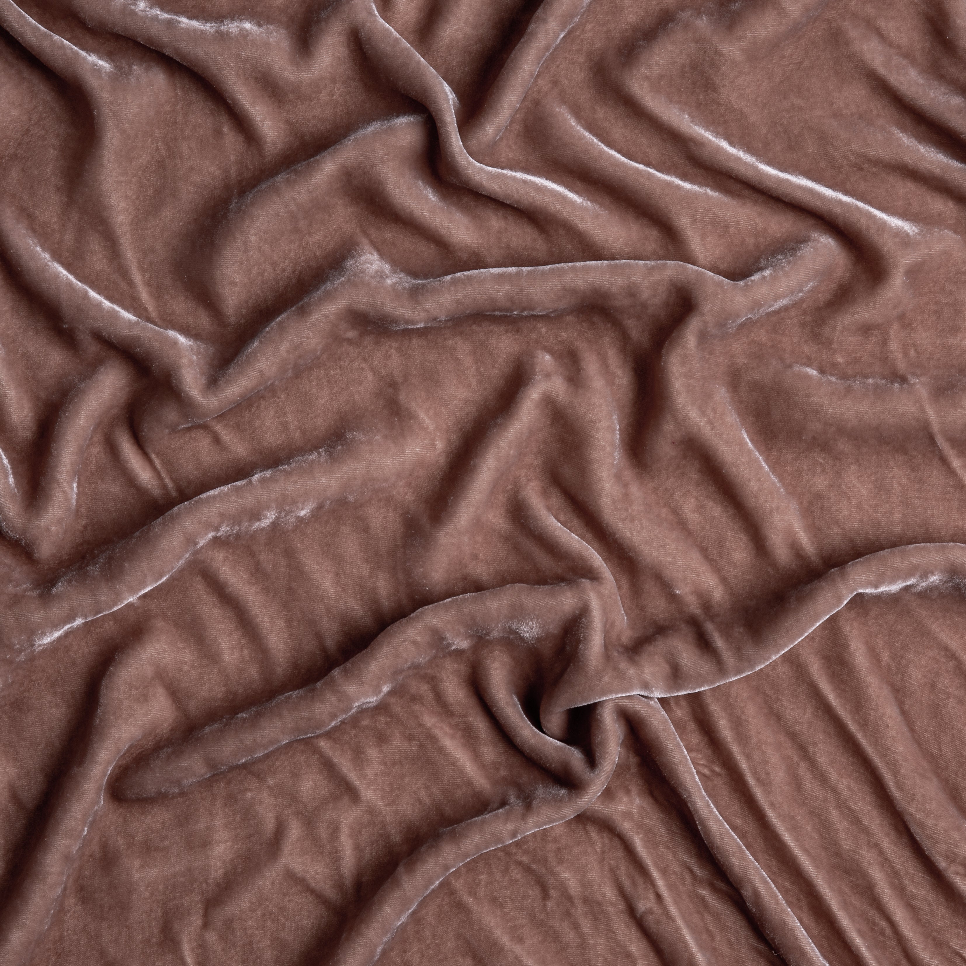 Rouge: A close up of silk velvet fabric in rouge, a mid-tone blush pink.