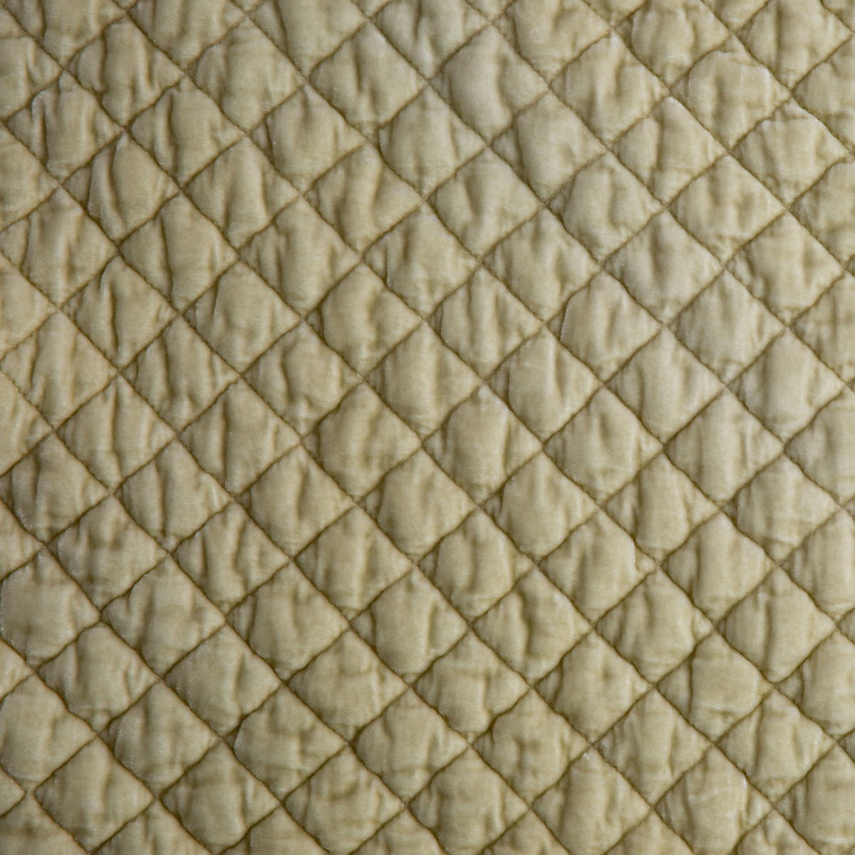 Parchment: Close-up of quilted silk velvet in parchment, a warm, antiqued cream.