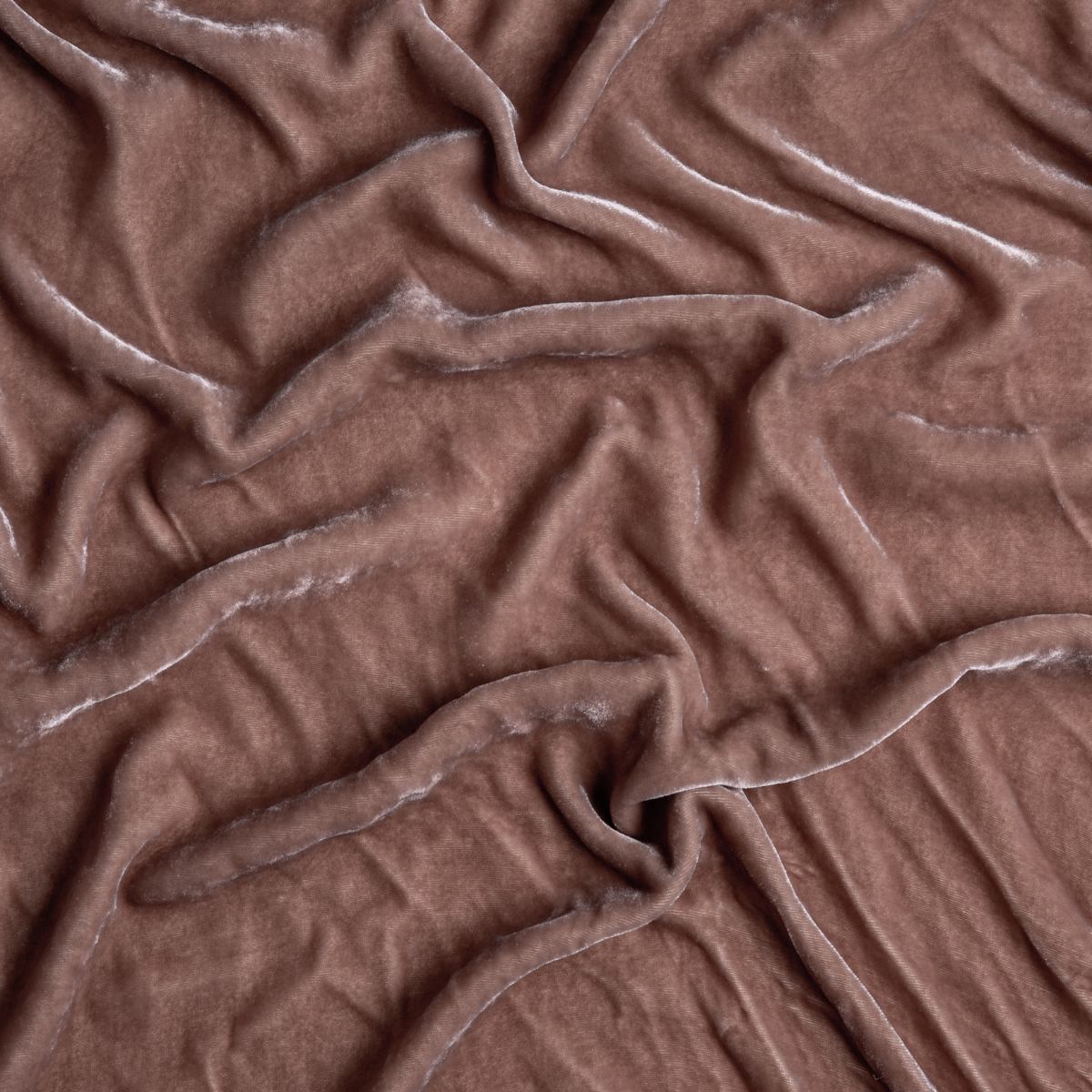 Rouge: A close up of silk velvet fabric in rouge, a mid-tone blush pink.