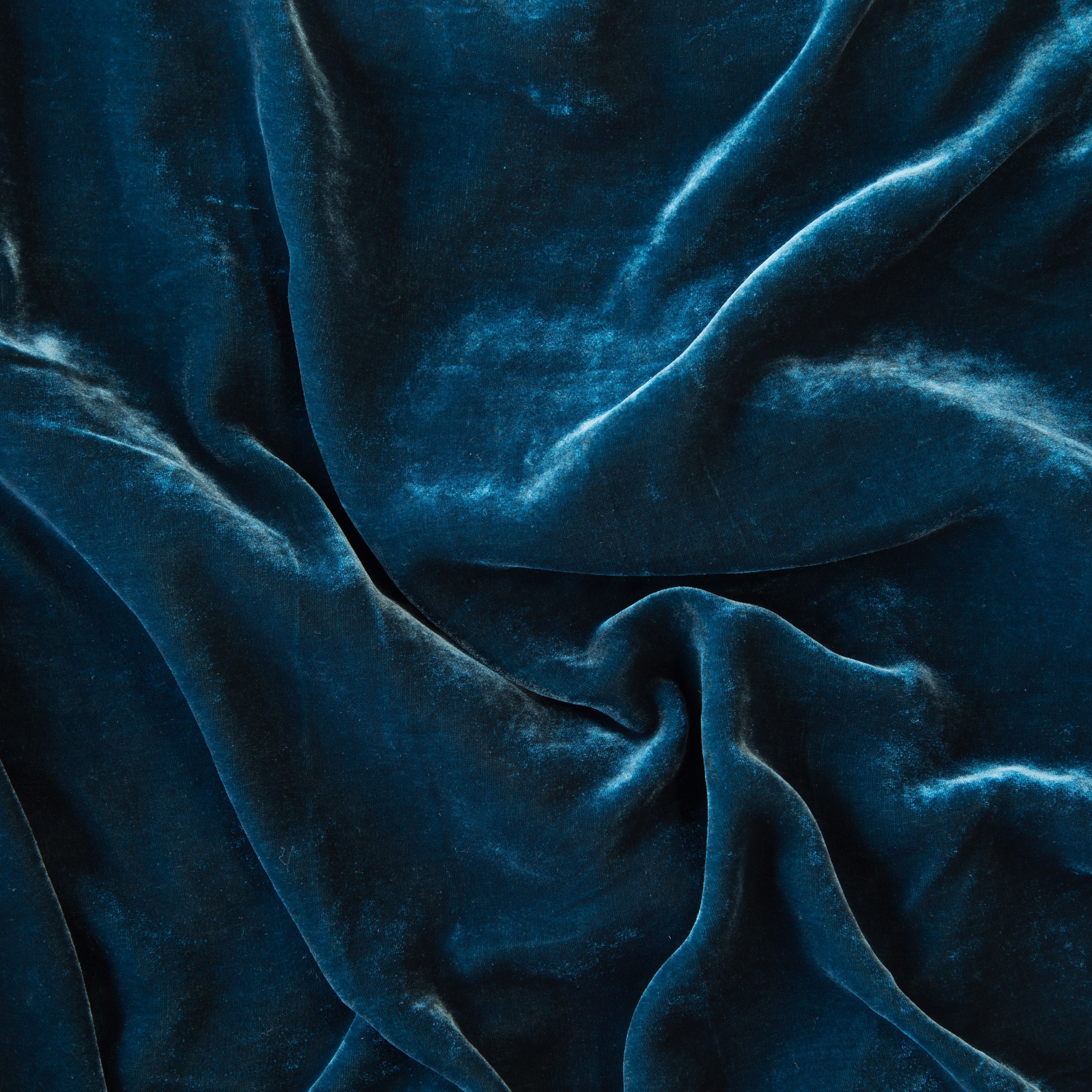 Cenote: A close up of silk velvet in cenote, a vibrant, ocean-inspired blue-green.