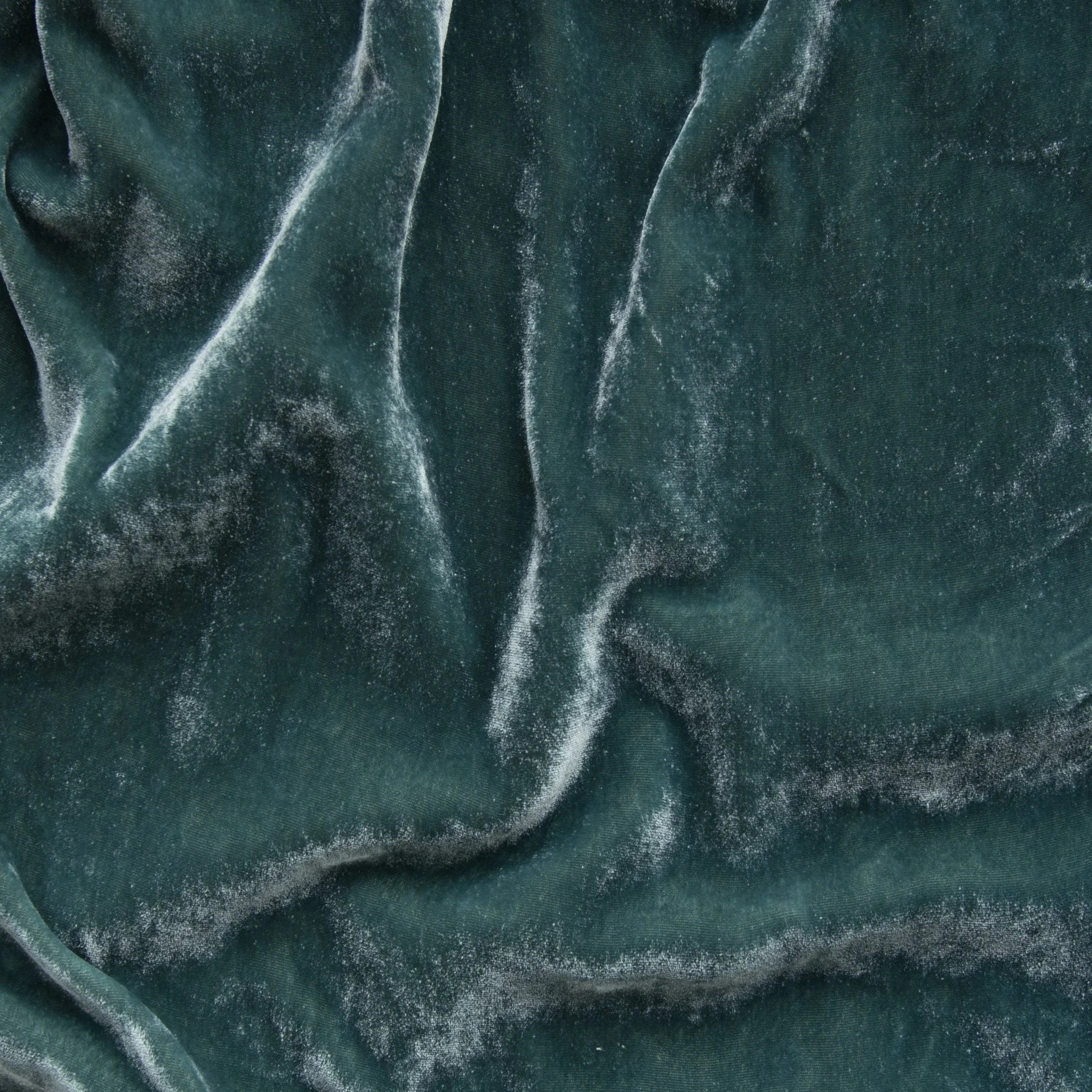 Eucalyptus: A close up of silk velvet in eucalyptus, a soft light green.