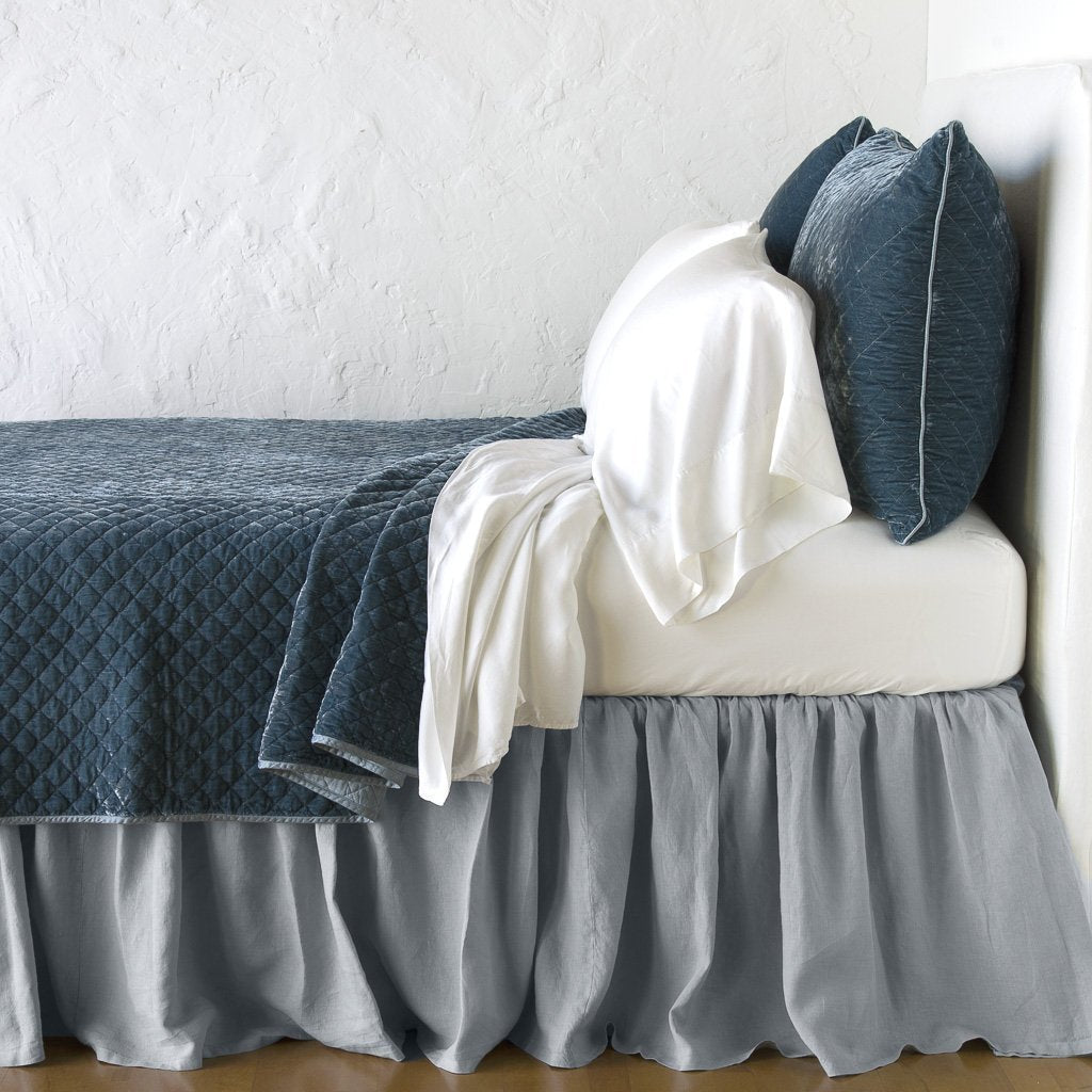 Mineral: coverlet with matching shams and white sheeting - side view.