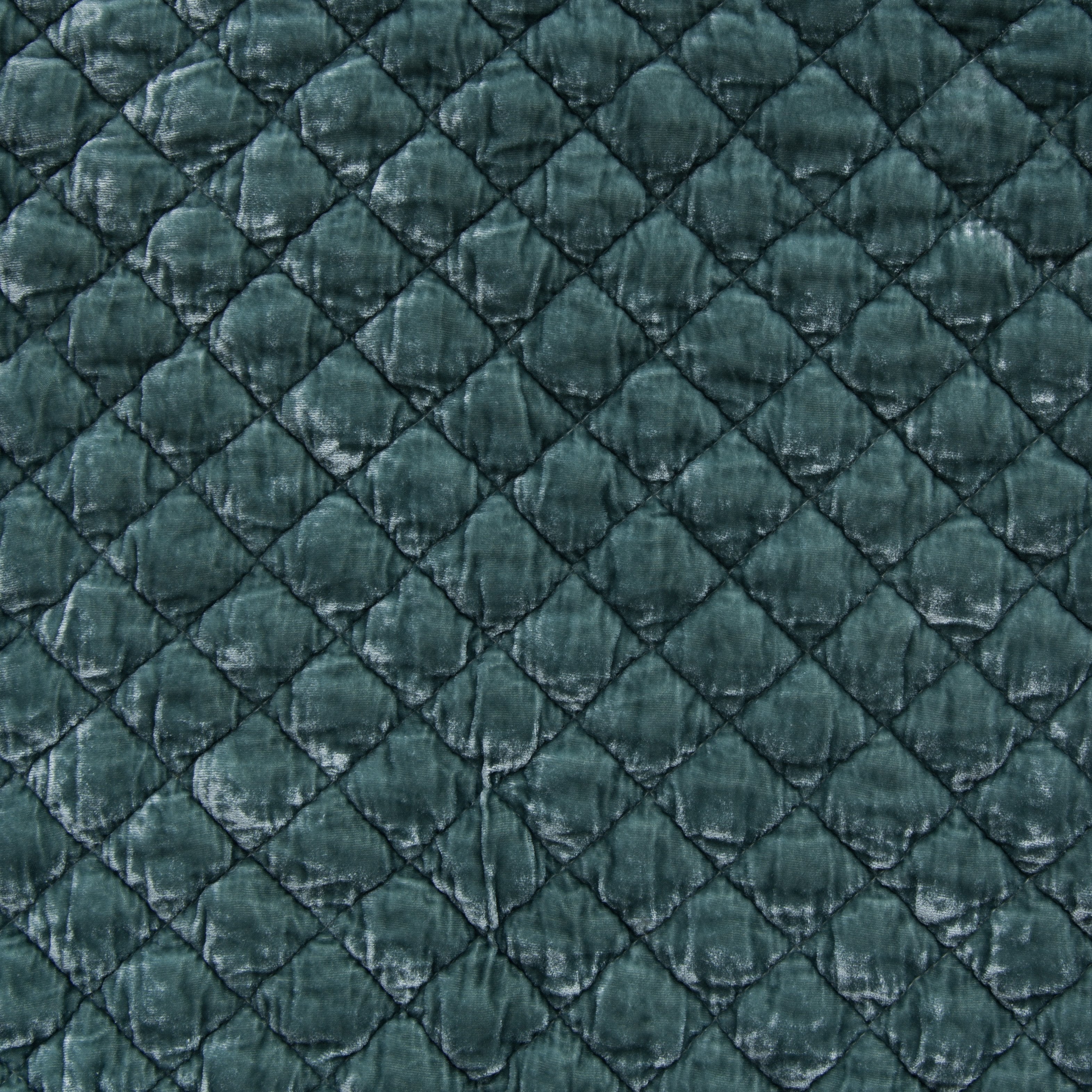 Eucalyptus: Close-up of quilted silk velvet in eucalyptus, a soft, light green.