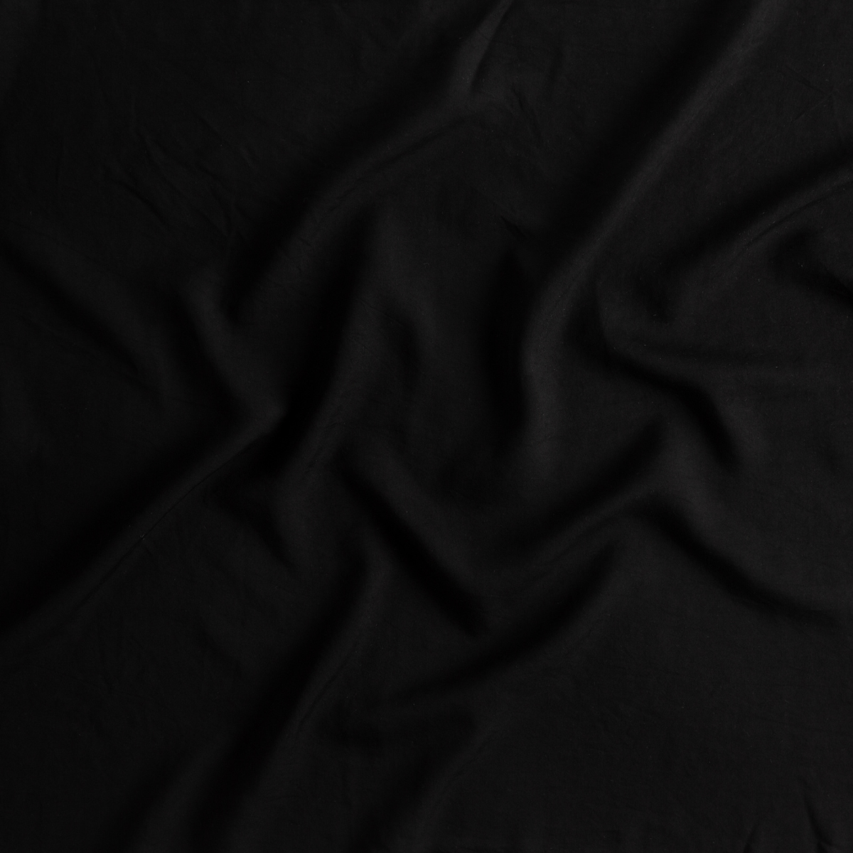 Corvino: A close up of tencel fabric in Corvino, a black tone