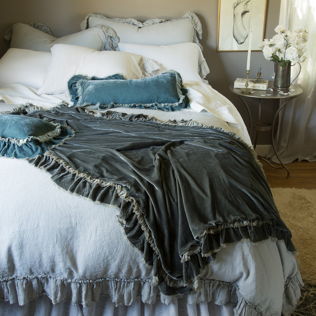 : Loulah Accent pillows with matching throw blanket, layered over a Linen Whisper bed, highlighing how to mix ruffles in different textures.