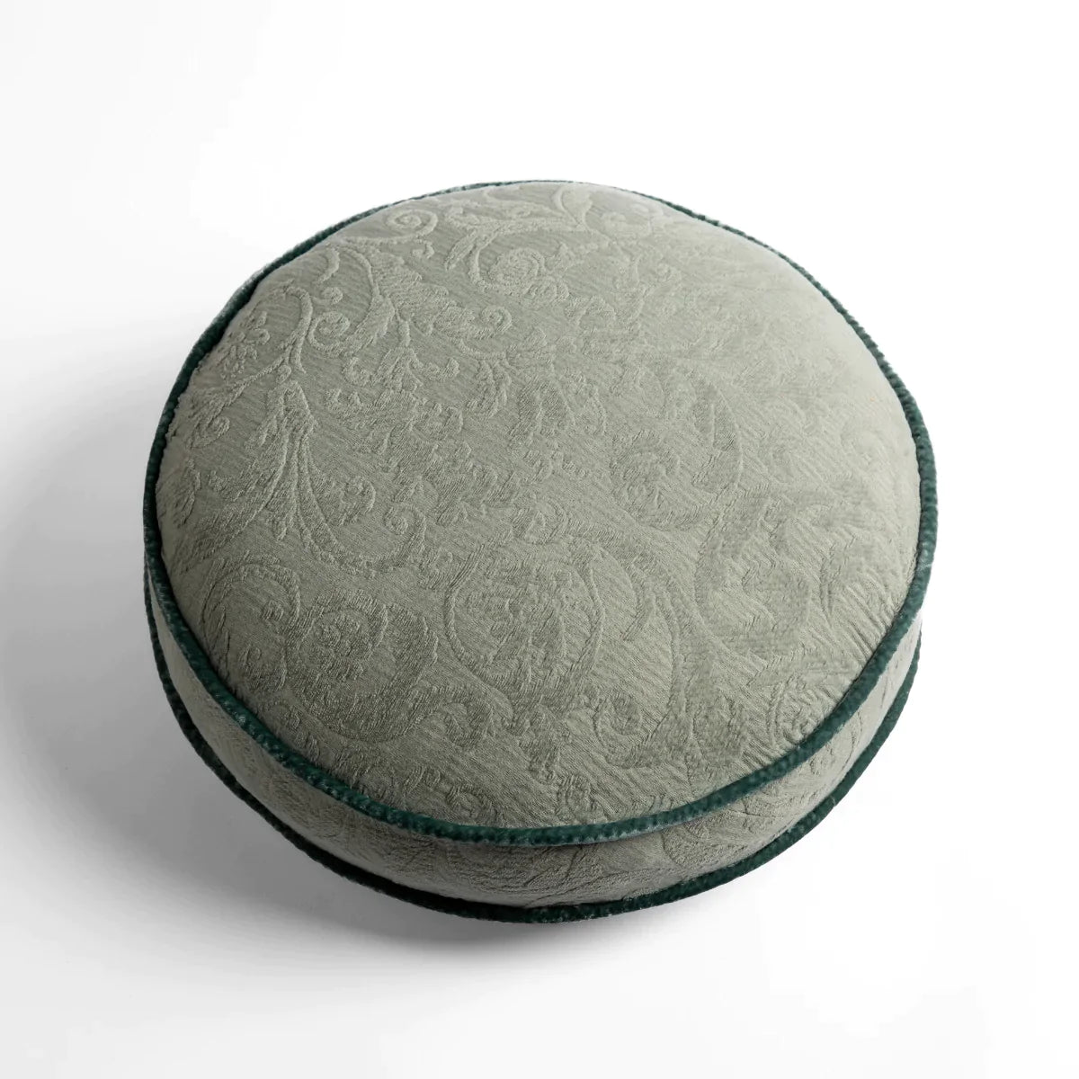 Eucalyptus: Organic cotton damask round pillow with silk velvet trim on white background β overhead angle.