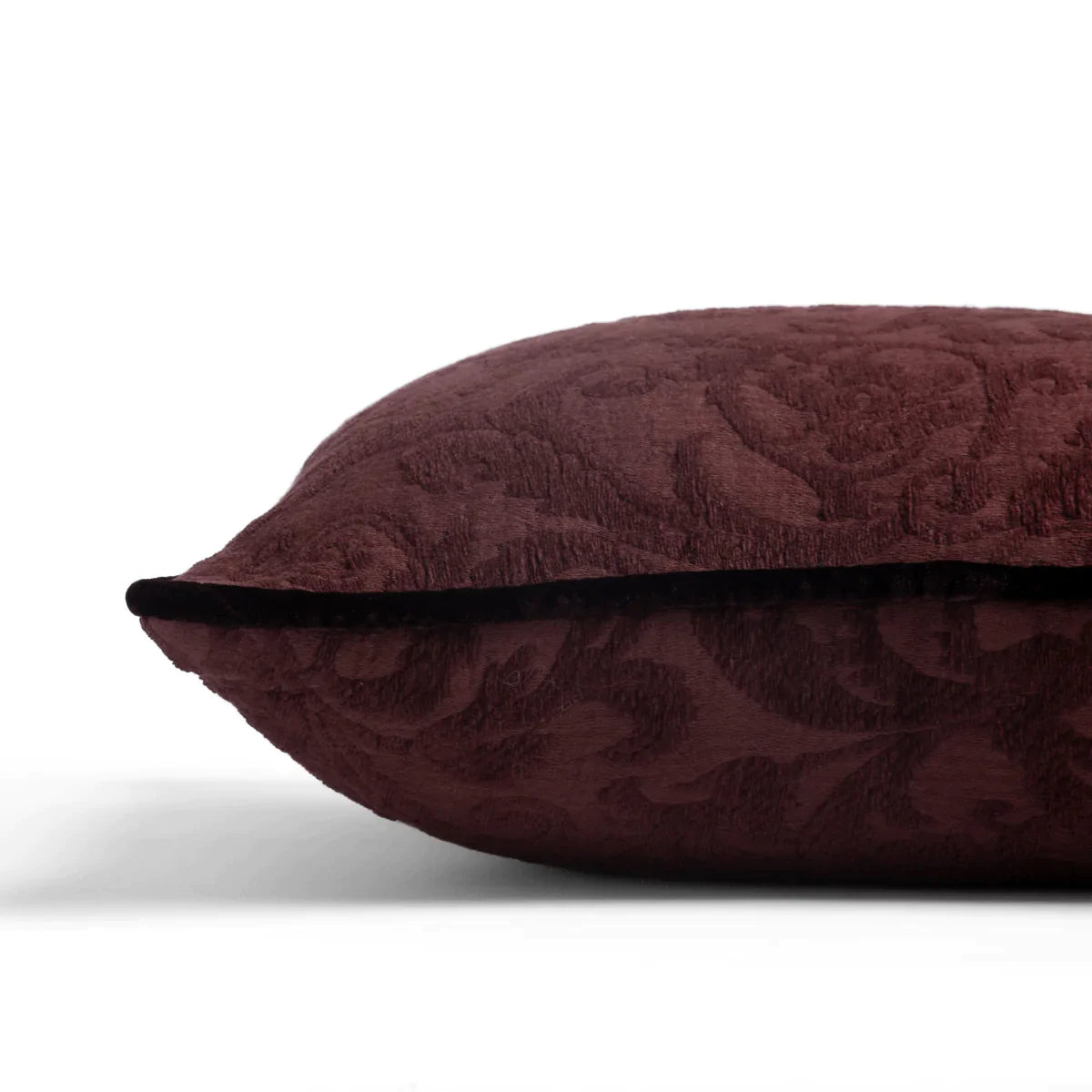 Mahogany: Organic cotton damask square pillow with silk velvet trim on white background β side angle.