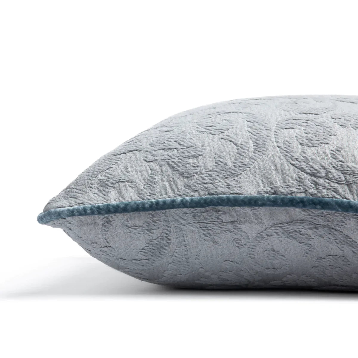 Mineral: Organic cotton damask square pillow with silk velvet trim on white background β side angle.