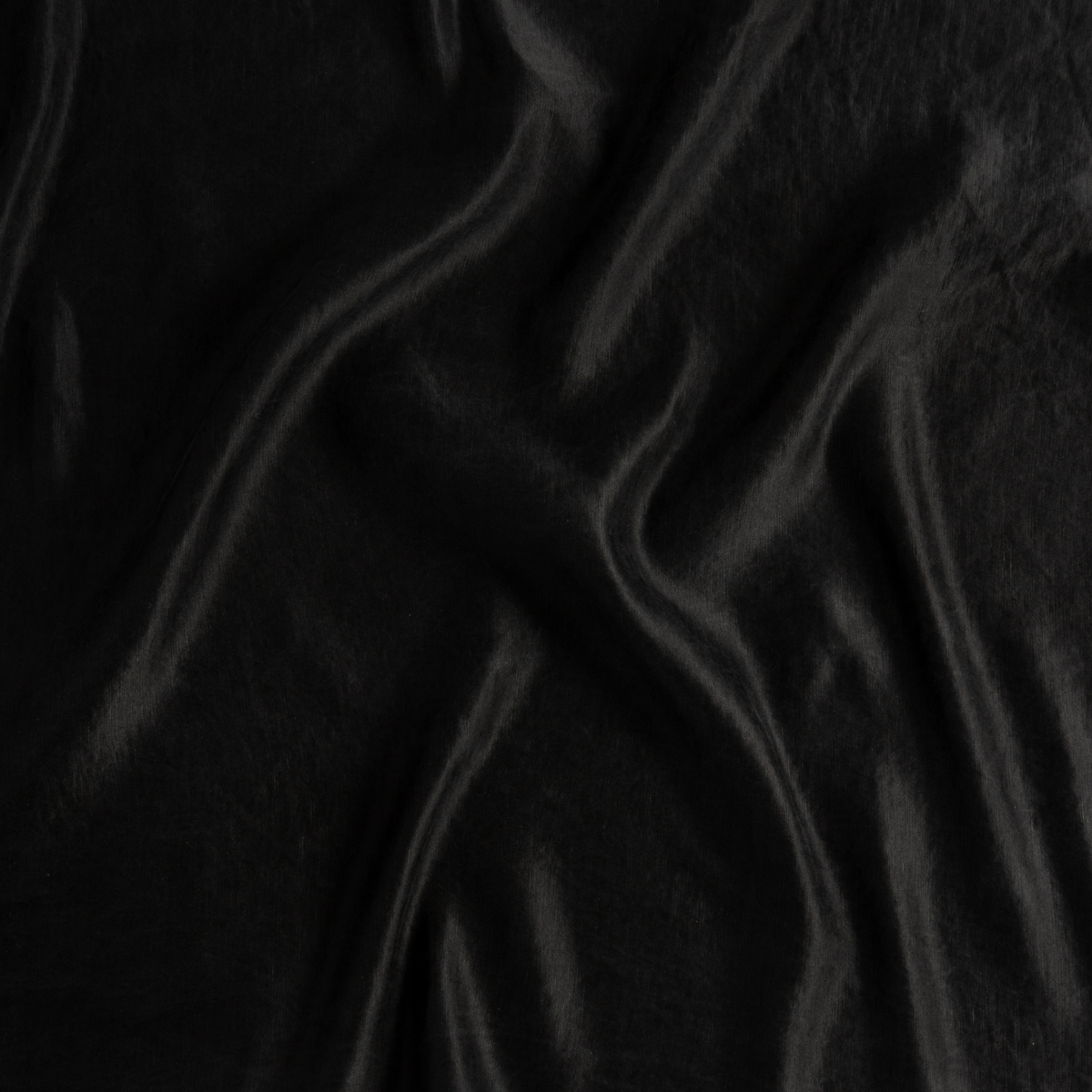Corvino: A close up of charmeuse fabric in Corvino, a black tone