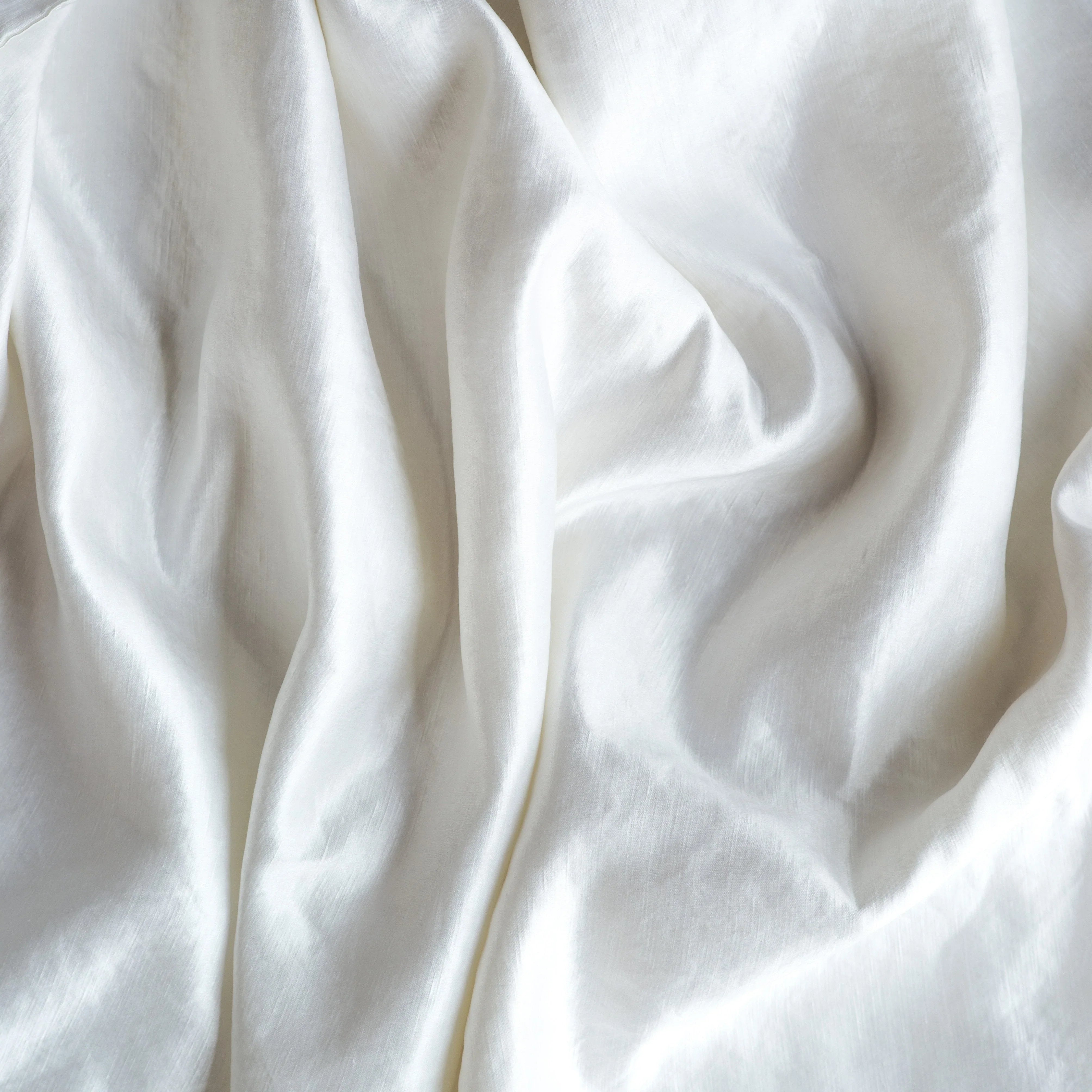 White: Close-up of silk charmeuse in white.