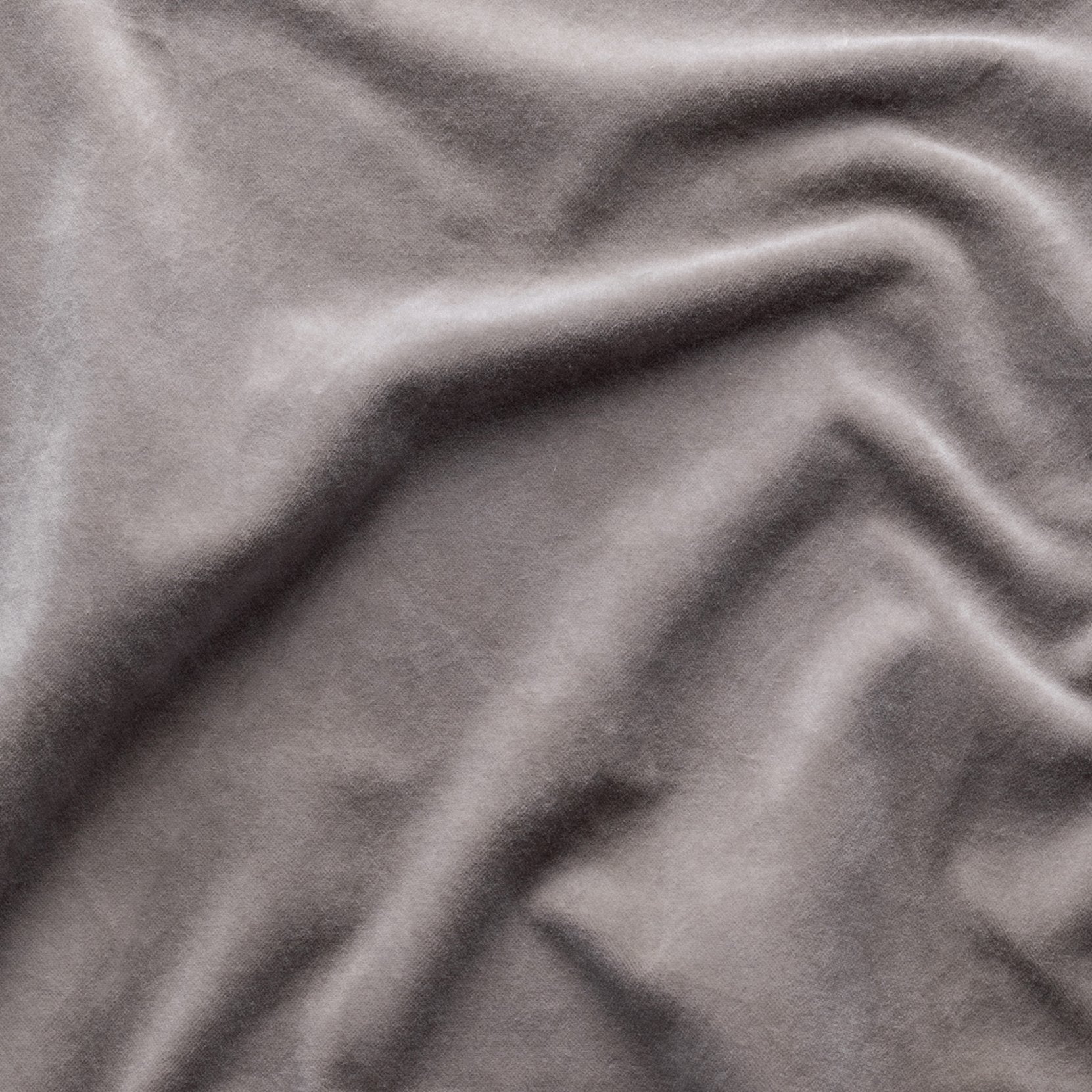 Fog: A close up of cotton velvet in fog, a neutral-warm, soft mid-tone grey.