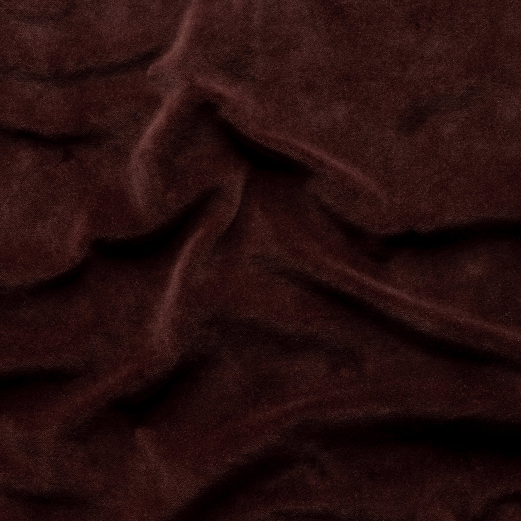 Mahogany: A close up of cotton velvet in mahogany, a deep, earthen, reddish brown.