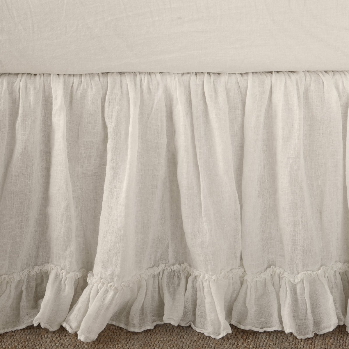 Parchment: Close up of bed skirt, showcasing ruffle detail - side view.