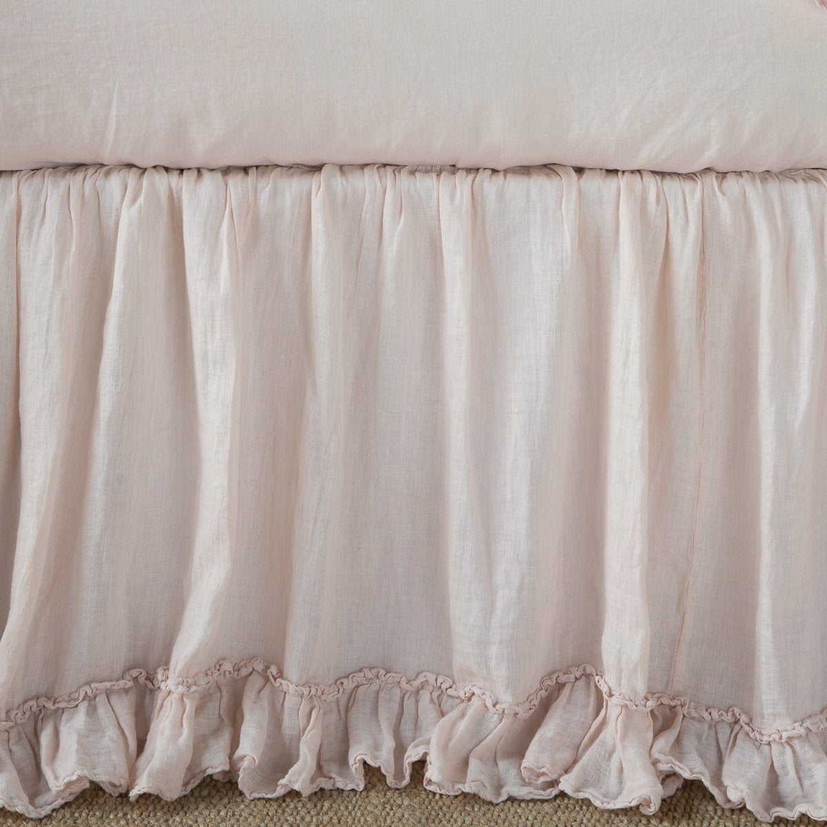 Pearl: Close up of bed skirt, showcasing ruffle detail - side view.