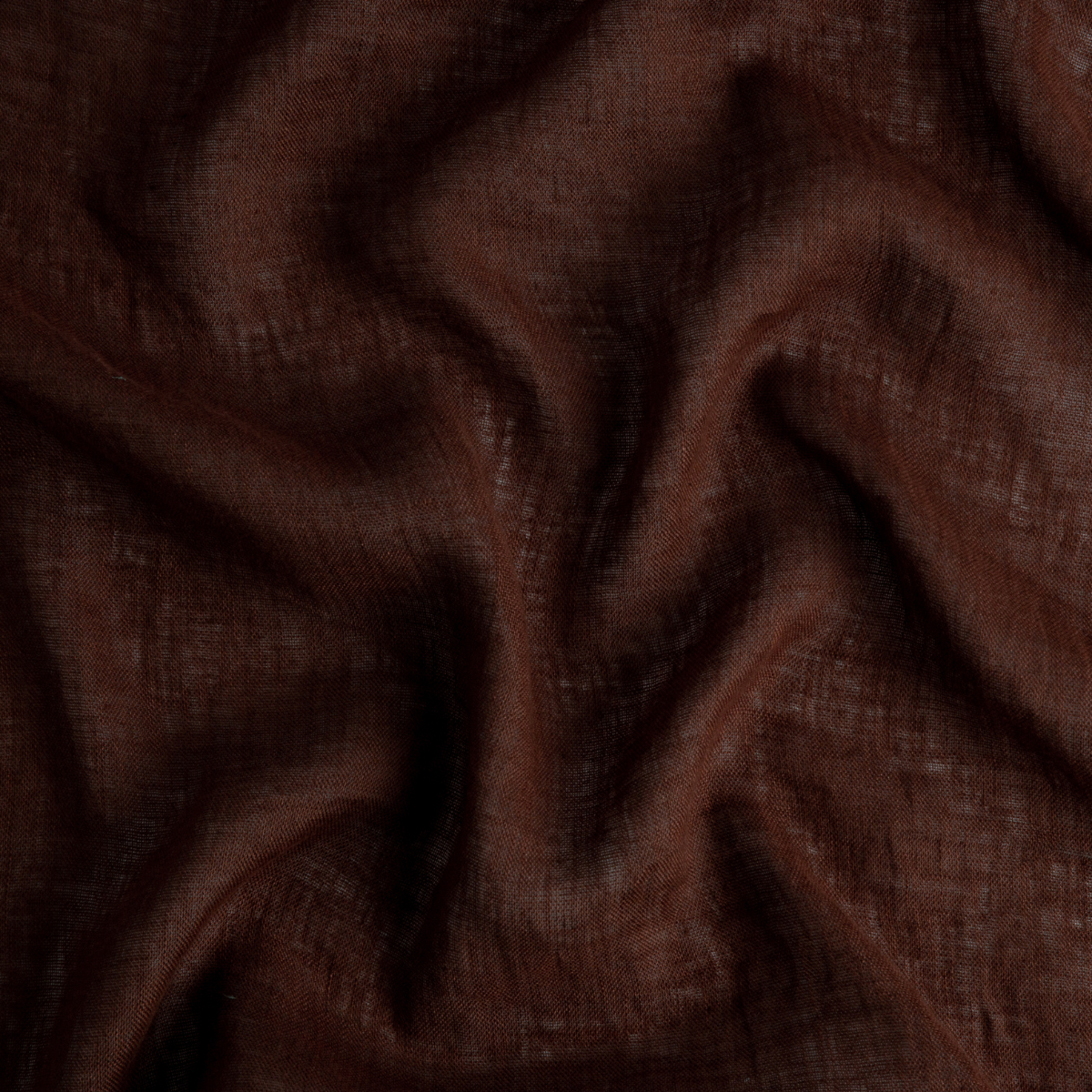 Mahogany: A close up of linen whisper, our lightweight linen gauze, in mahogany, a deep, earthen, reddish brown.