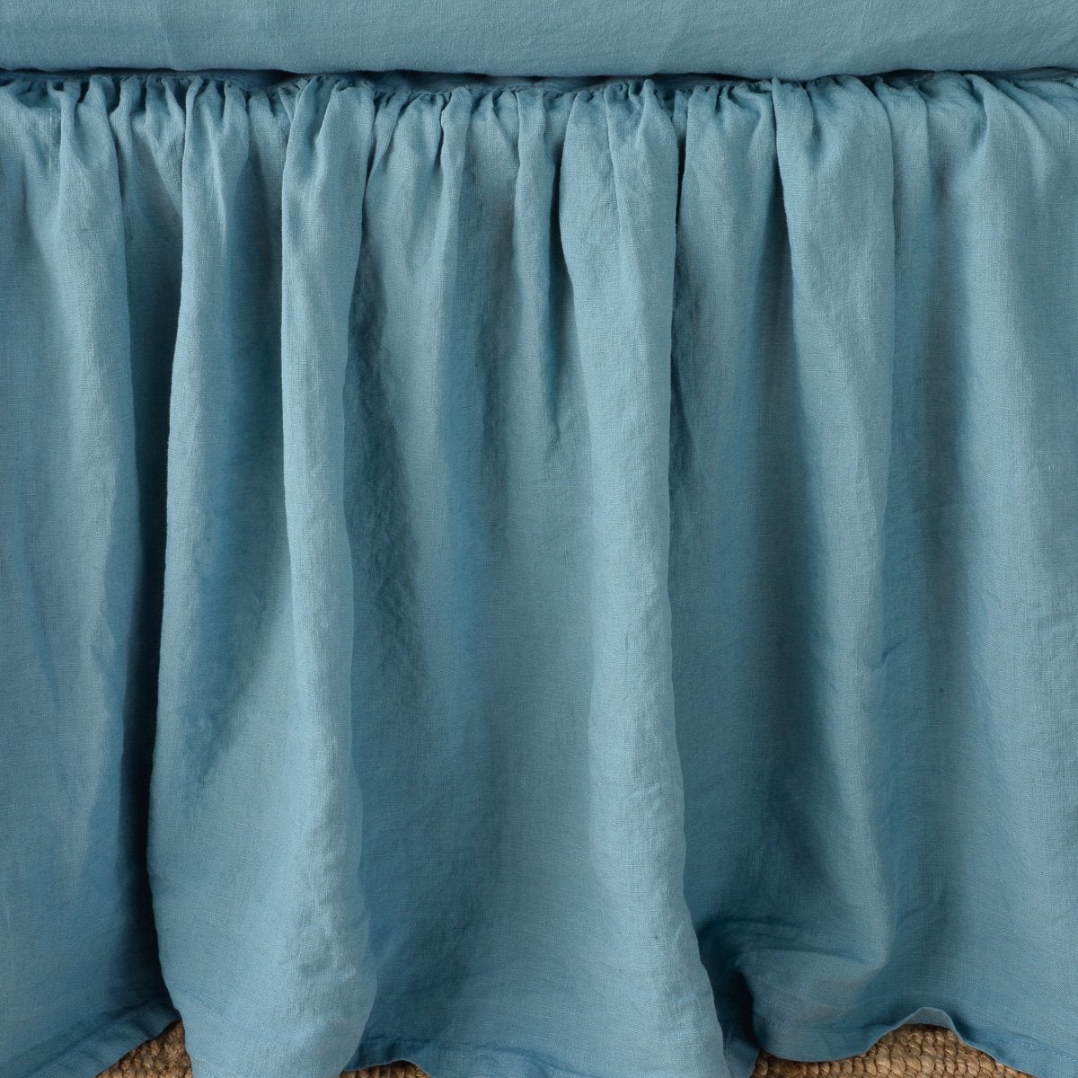 Cenote: Close-up of bed skirt, featuring its softly gathered design.