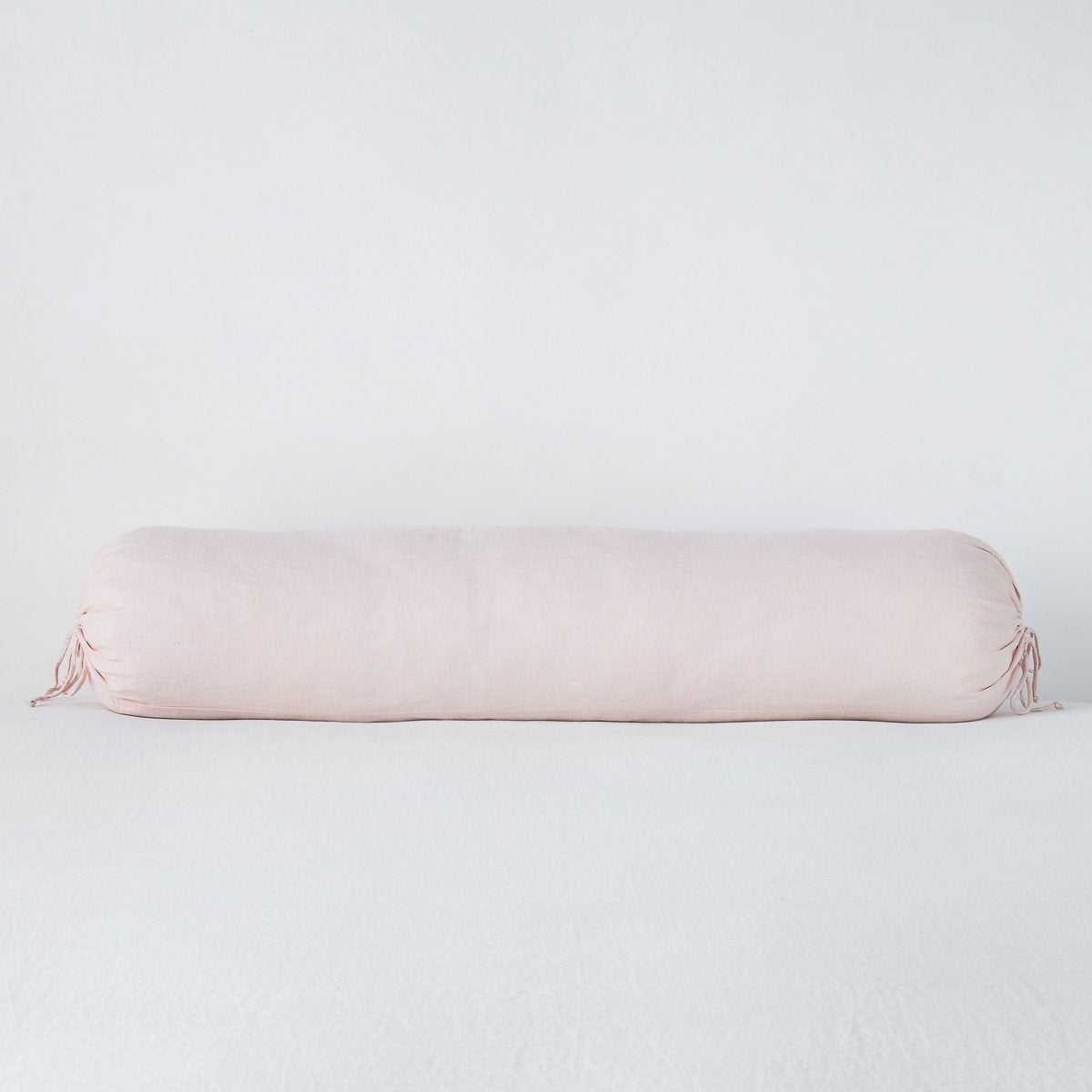 Pearl: bolster against a white background.