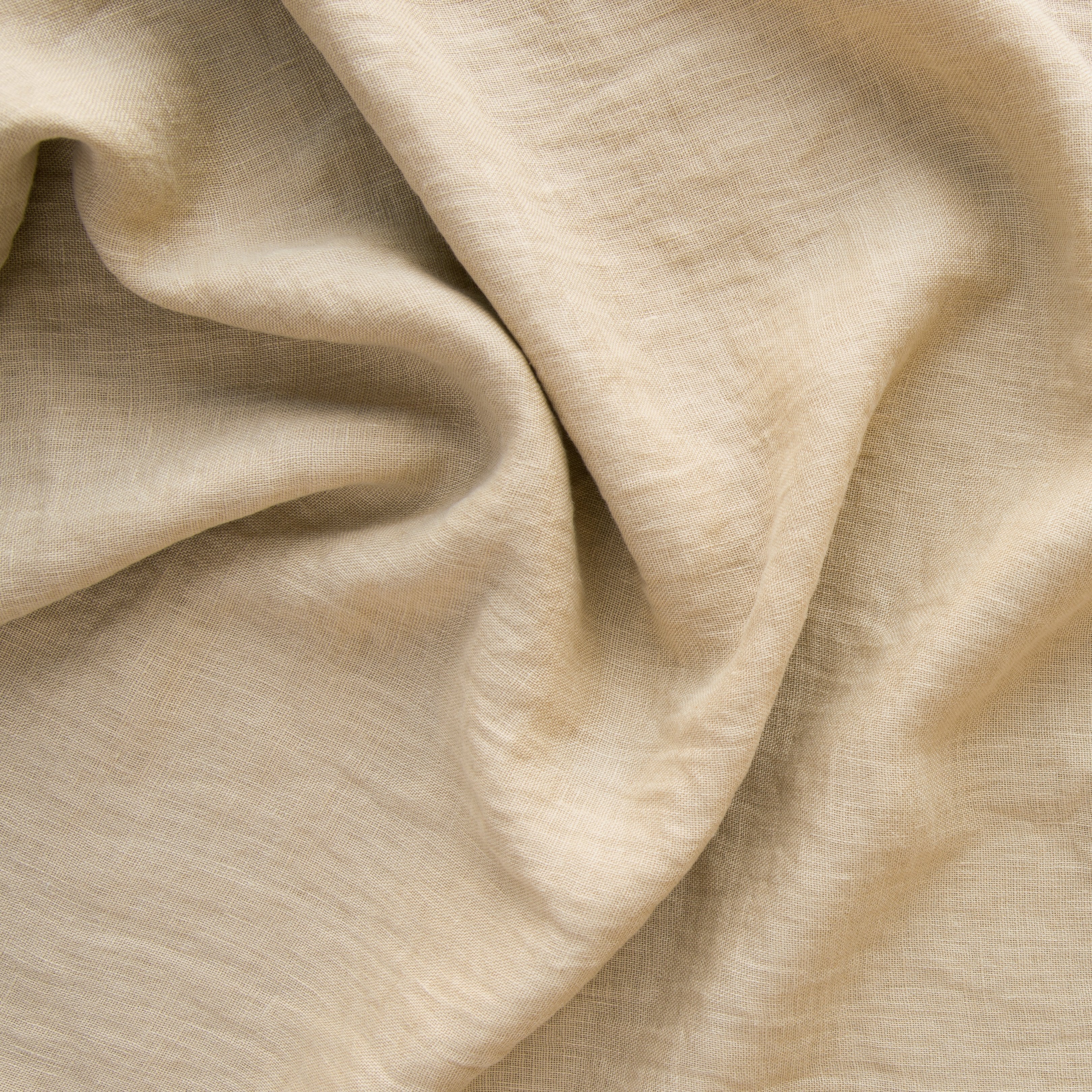 Honeycomb: A close up of linen whisper, our lightweight linen gauze, in honeycomb, a warm golden tone.